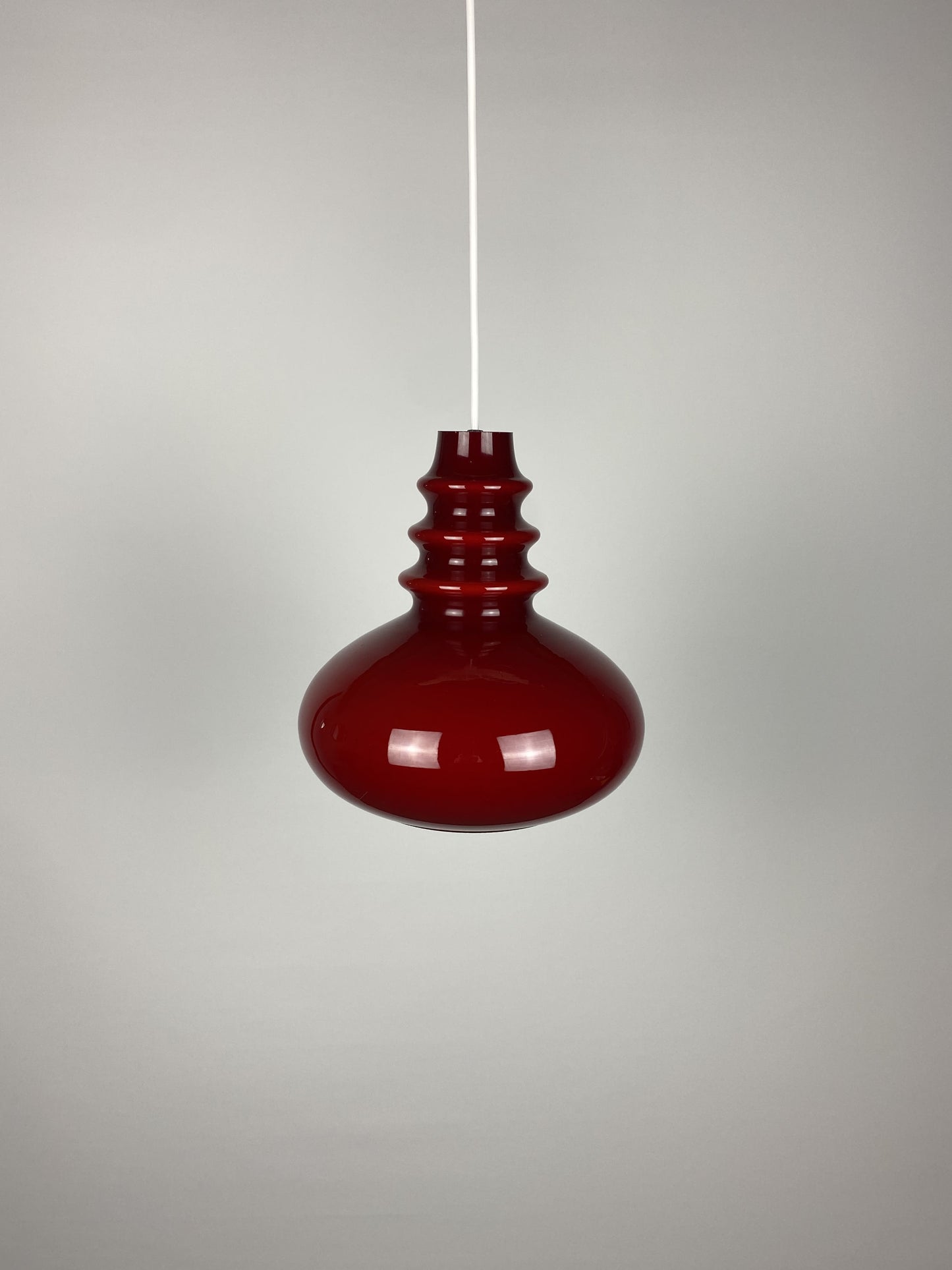 1 of 2 Dark red glass Peill & Putzler pendant light 1960