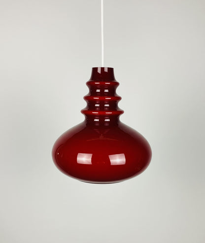 1 of 2 Dark red glass Peill & Putzler pendant light 1960