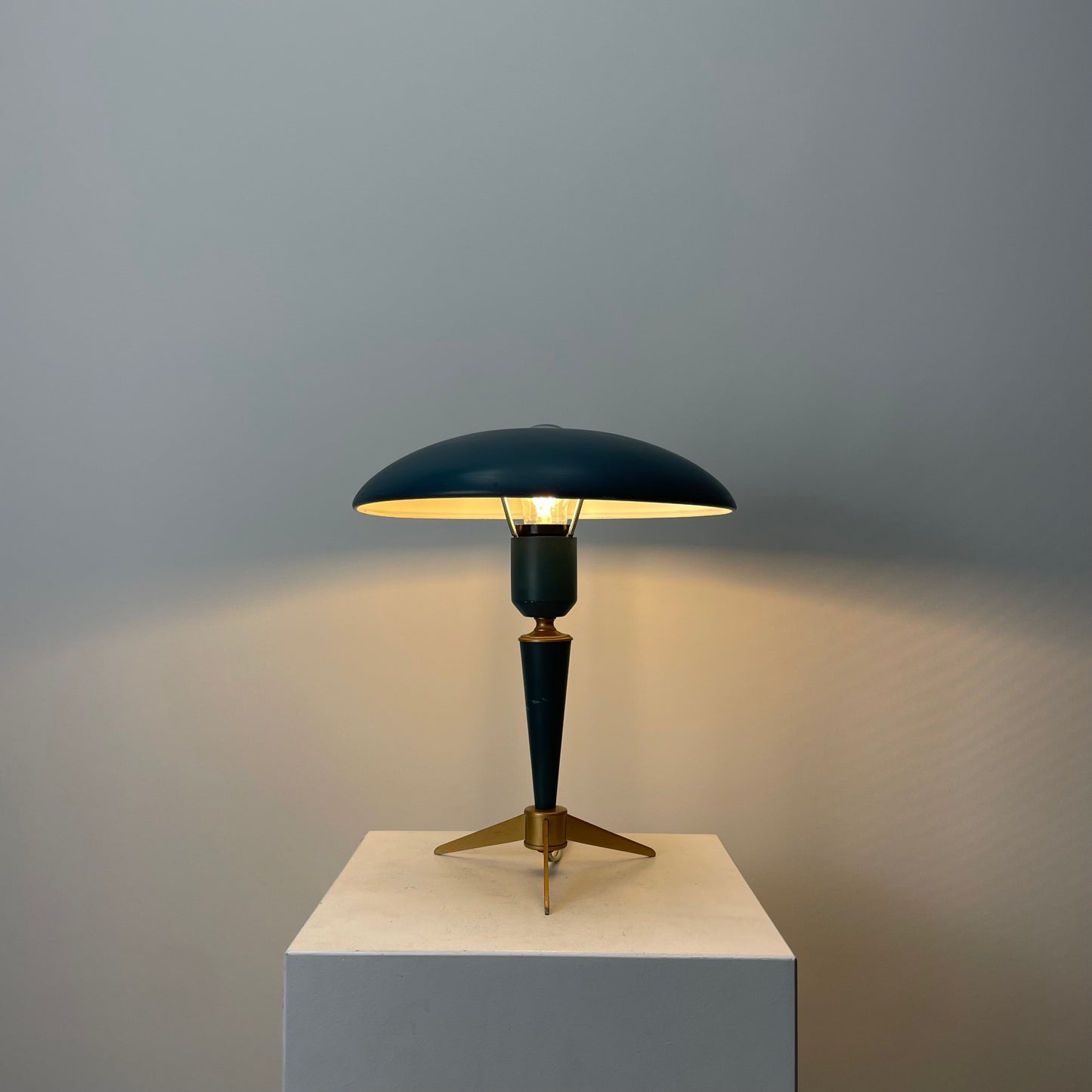 Louis Kalff lamp
Philips Bijou
Industrial design
1950s desk lamp
Dutch vintage design
Tripod lamp base
Mirror-top light
Green-blue color
Mid-century modern
Iconic designer lamp