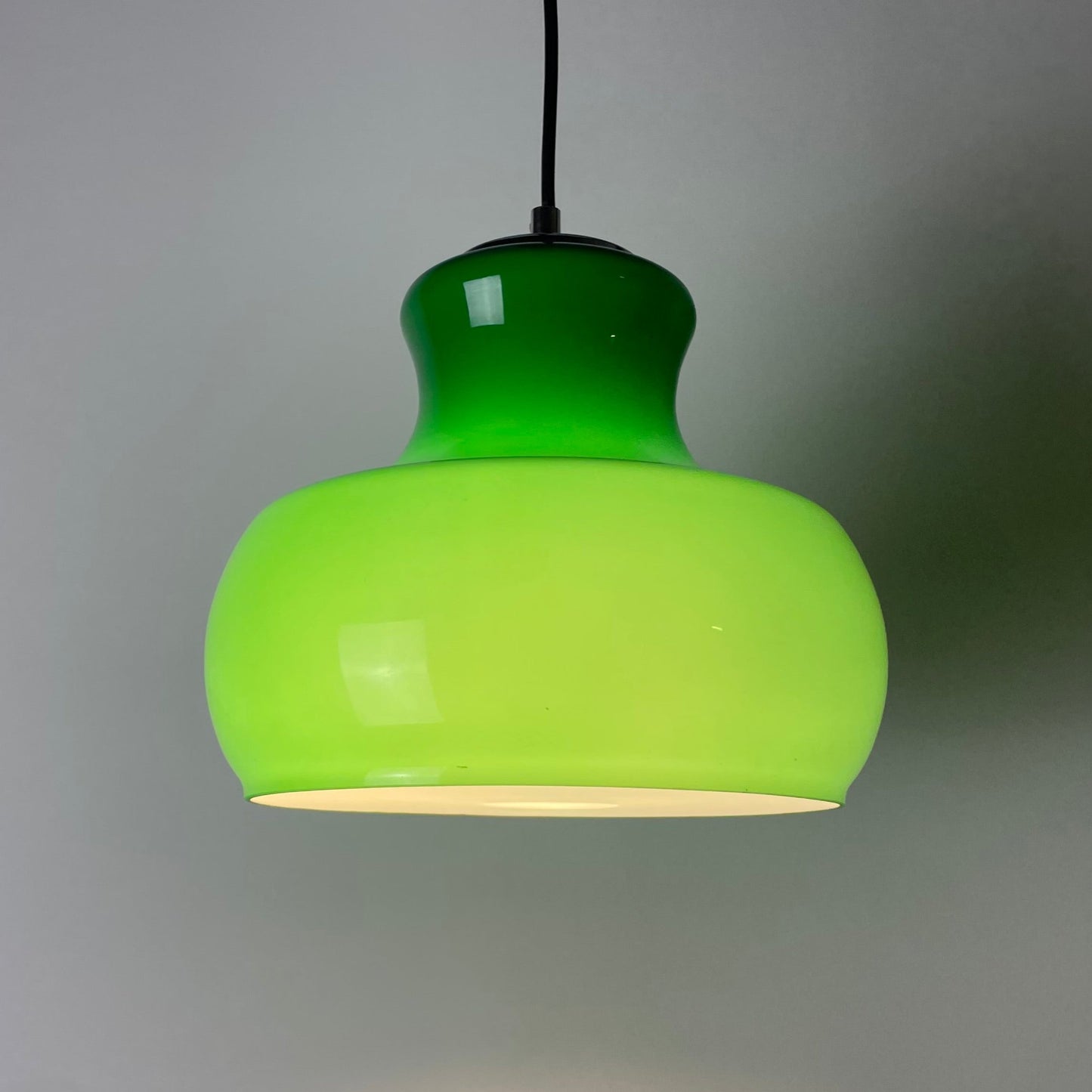 Green glass pendant light
German pendant light
1970s vintage lighting
Mid-century modern decor
Vintage German lighting
Rewired pendant light
Ambient green light
Rare green glass
German lighting design
Sleek 1970s pendant
honsel leuchten