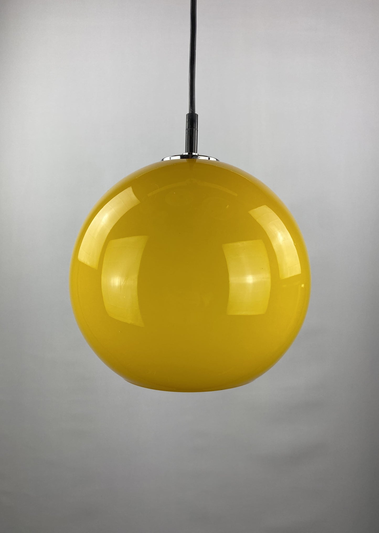 Yellow glass globe pendant light by Peill and Putzler 1960