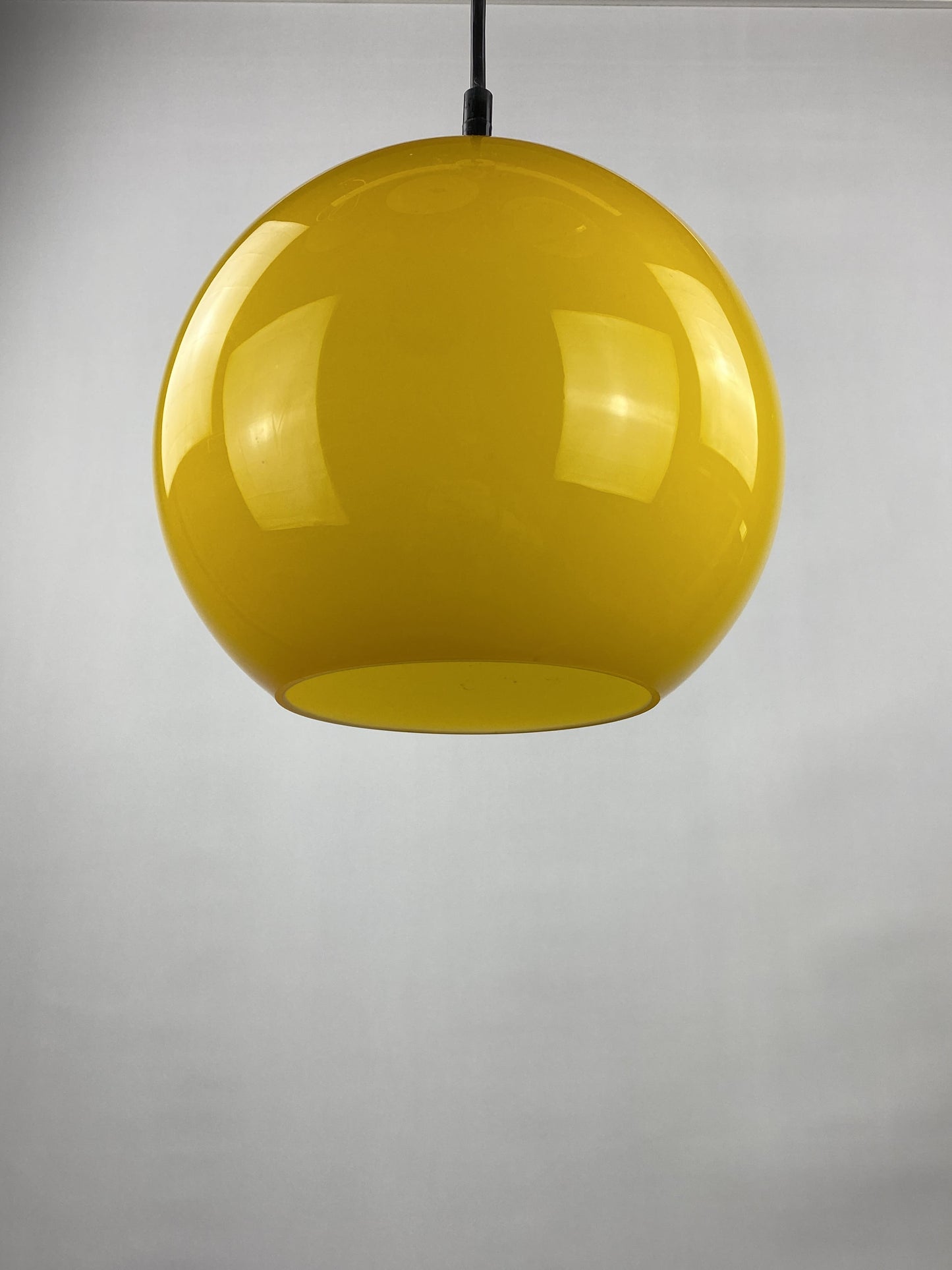 Yellow glass globe pendant light by Peill and Putzler 1960