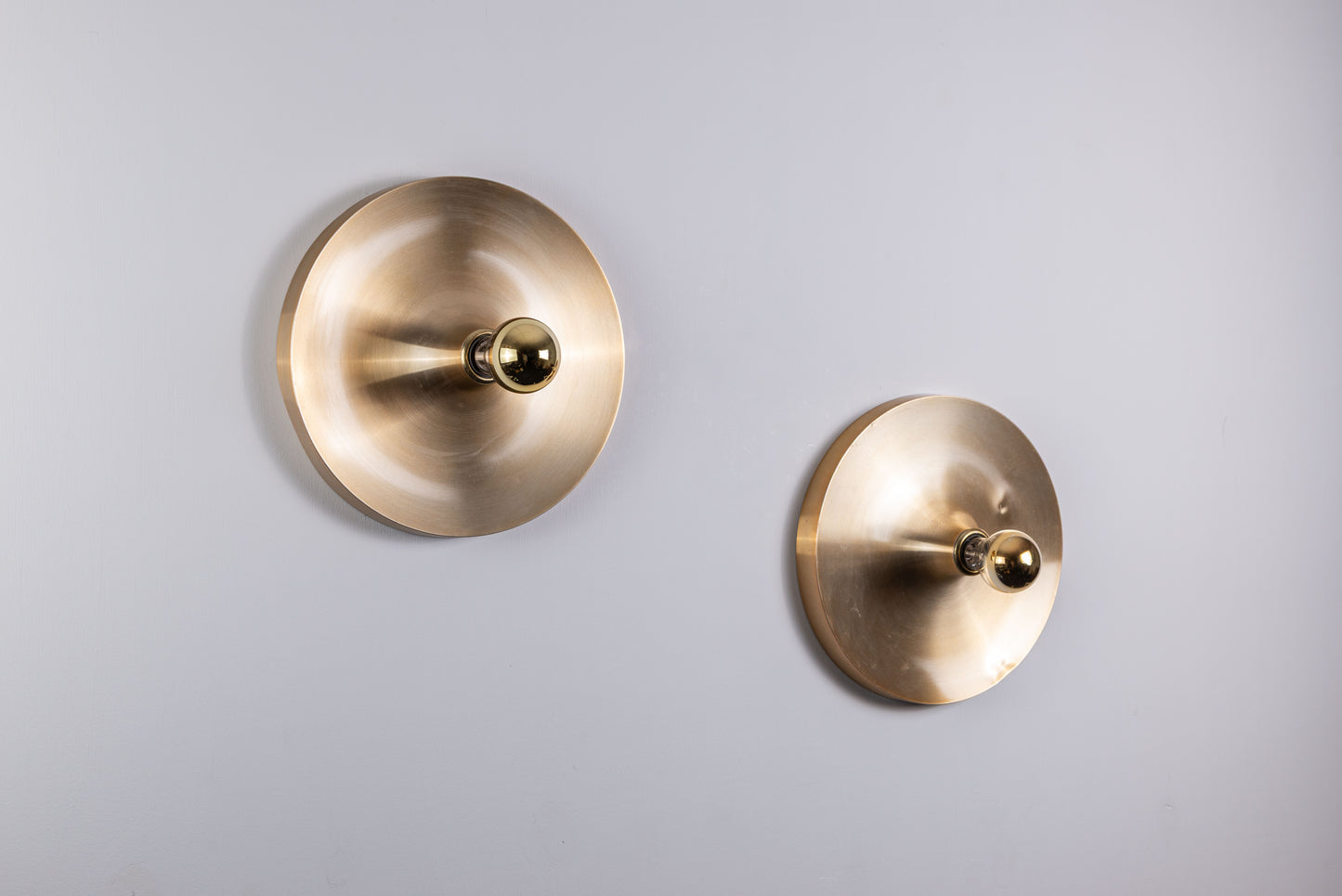 Pair of Honsel Disc sconces by Charlotte Perriand for Les Arcs (35cm)