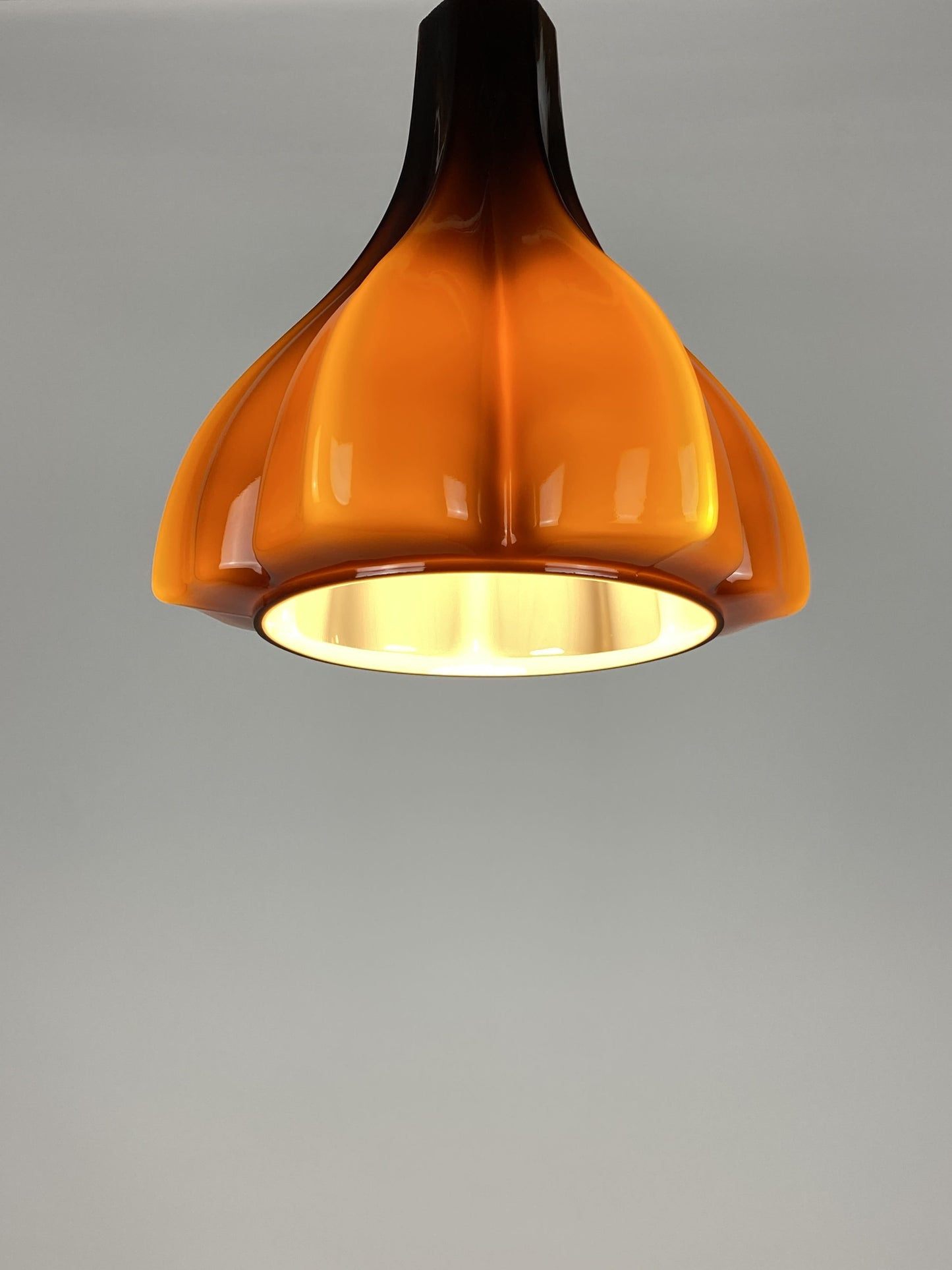 Flower shaped brown / caramel glass pendant light by Peill and Putzler 1960