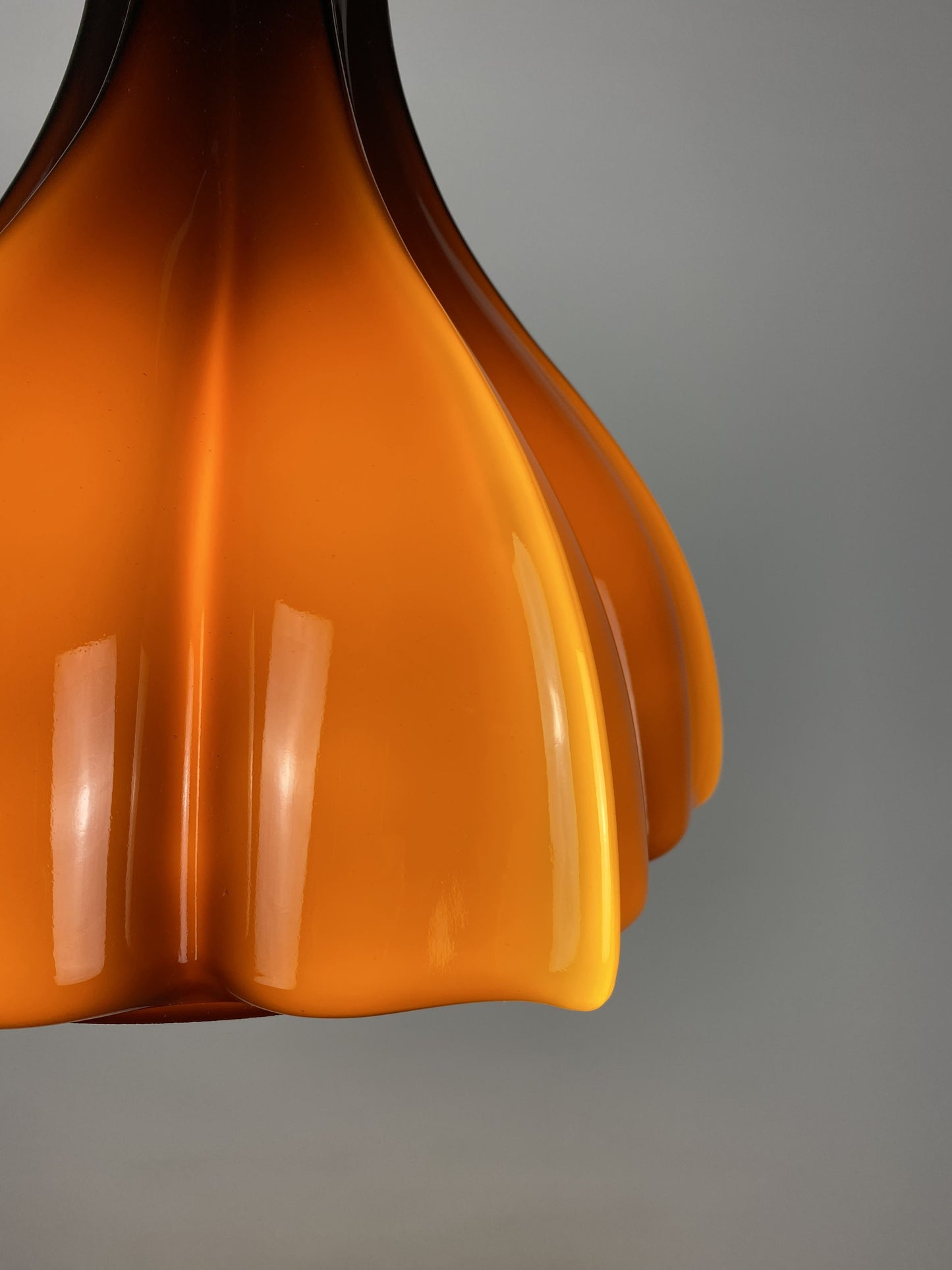 Flower shaped brown / caramel glass pendant light by Peill and Putzler 1960