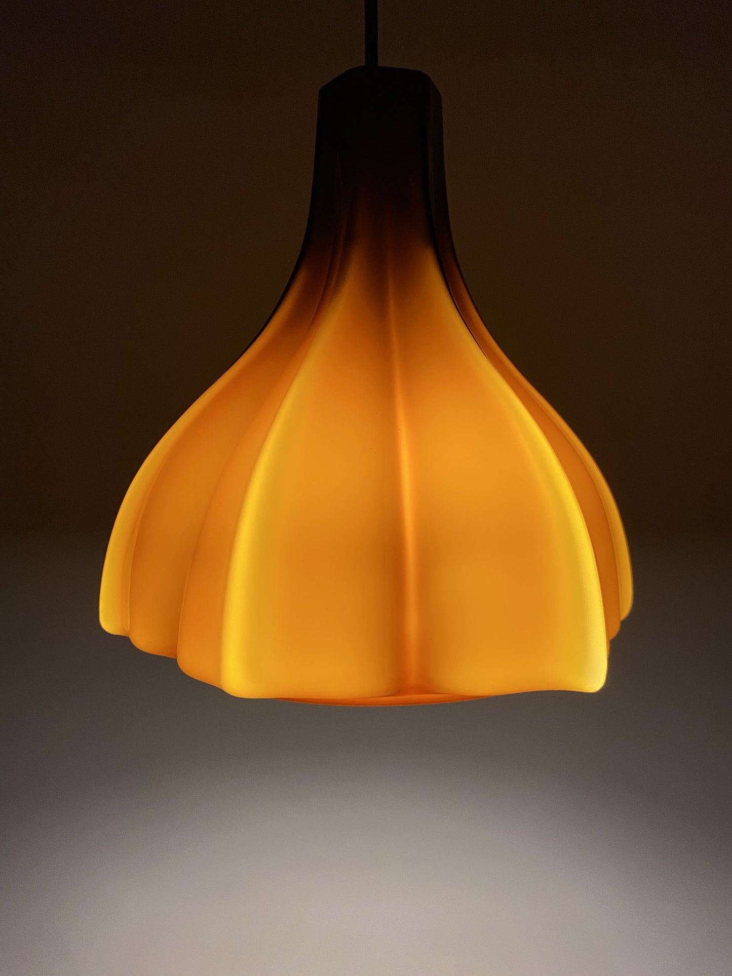Flower shaped brown / caramel glass pendant light by Peill and Putzler 1960
