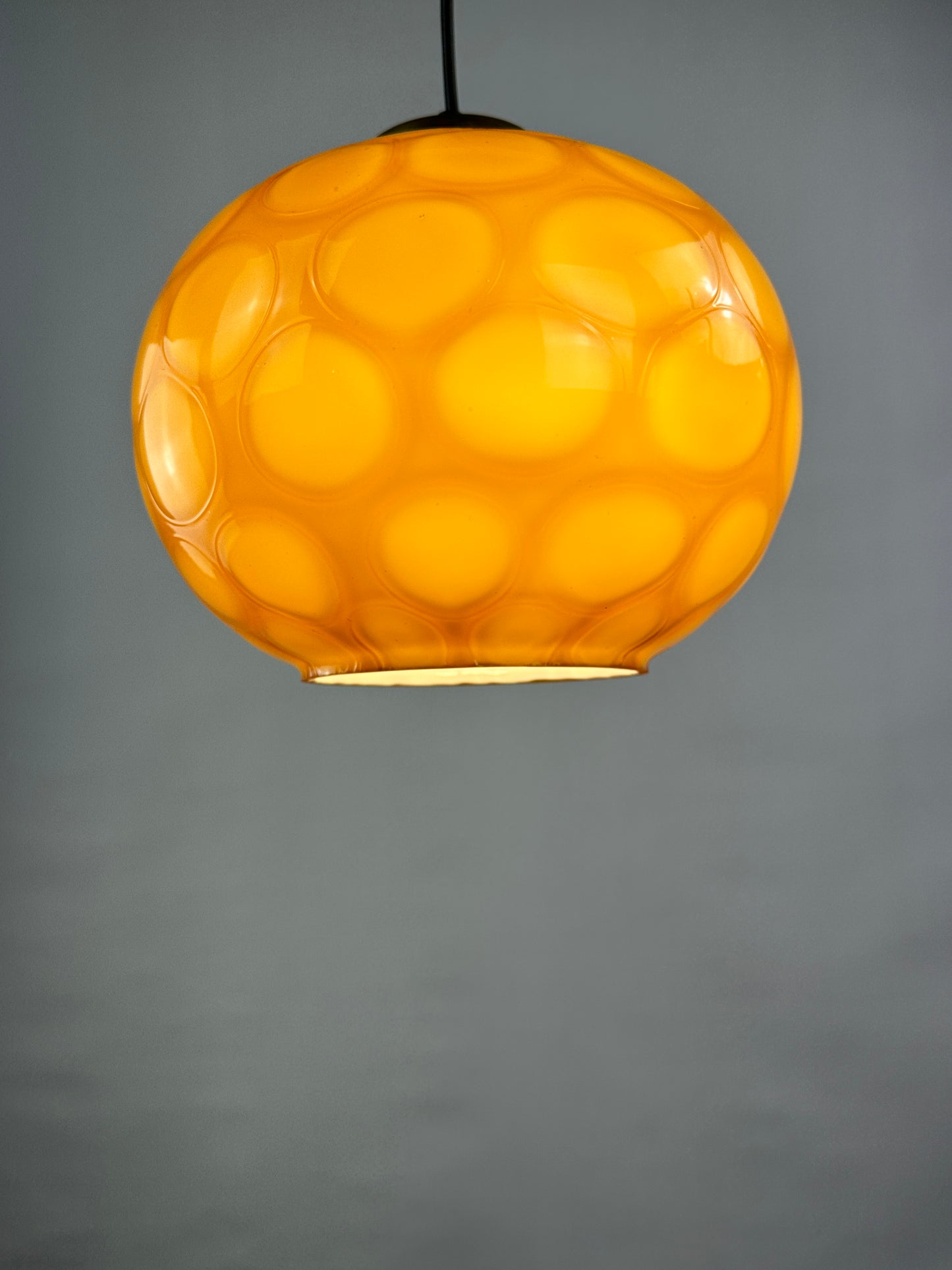 Caramel glass globe shaped pendant light from Germany, 1960