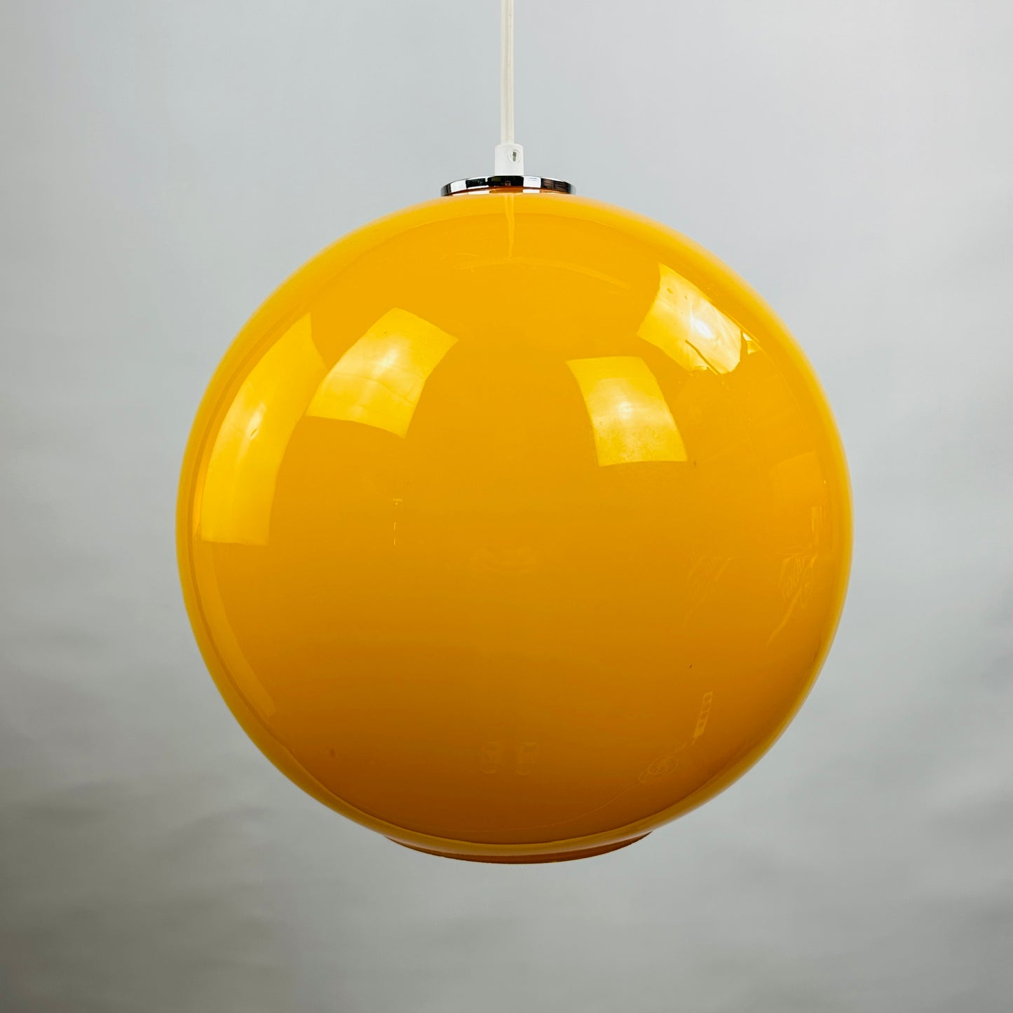 Yellow glass globe pendant light XL by Peill and Putzler 1960