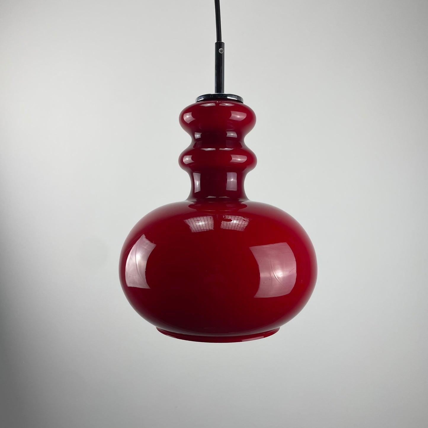 Red glass pendant light by Peill and Putzler, 1960