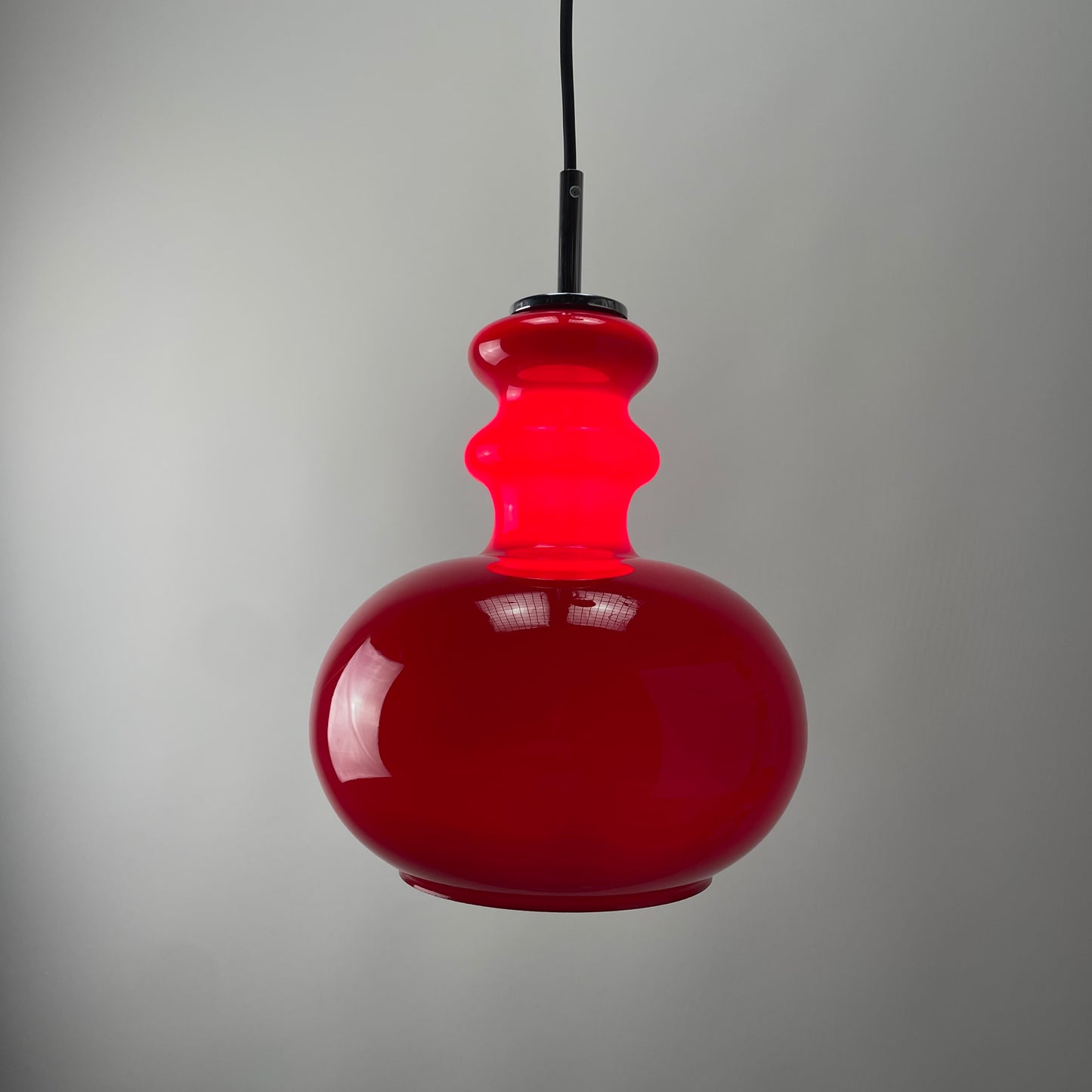 Red glass pendant light by Peill and Putzler, 1960