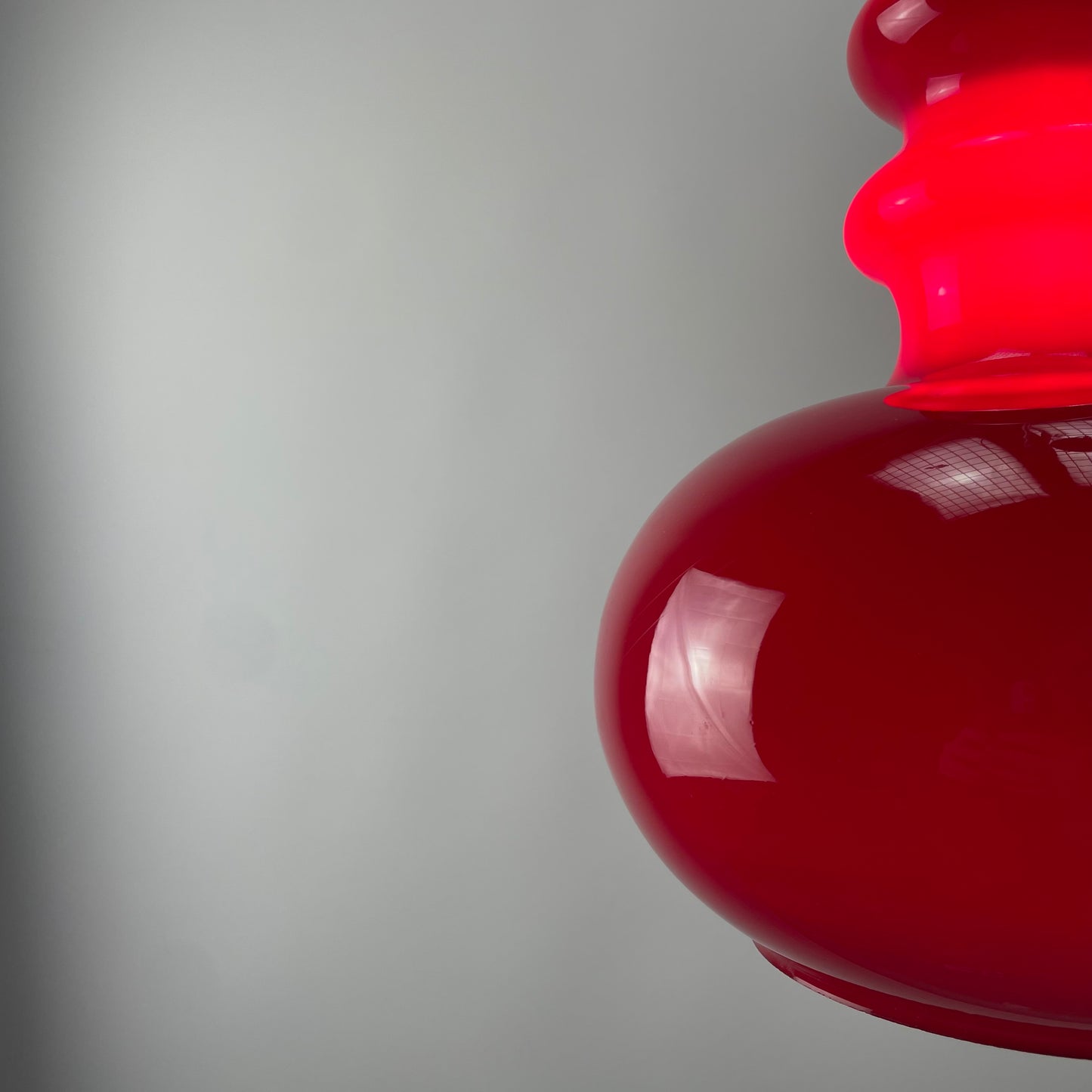 Red glass pendant light by Peill and Putzler, 1960