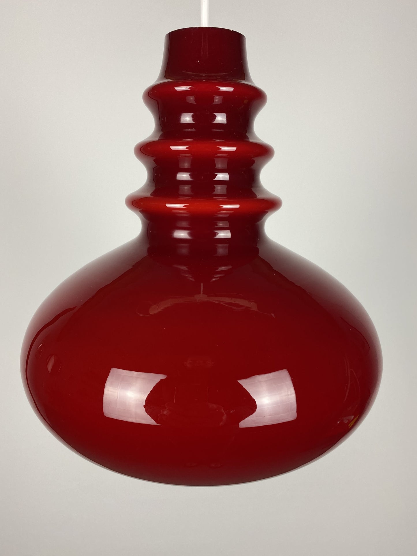 1 of 2 Dark red glass Peill & Putzler pendant light 1960