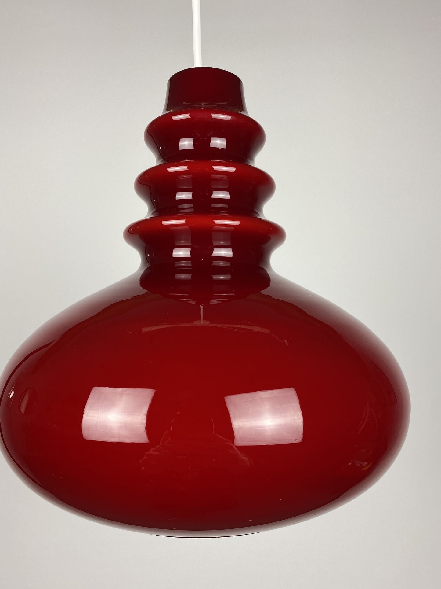 1 of 2 Dark red glass Peill & Putzler pendant light 1960