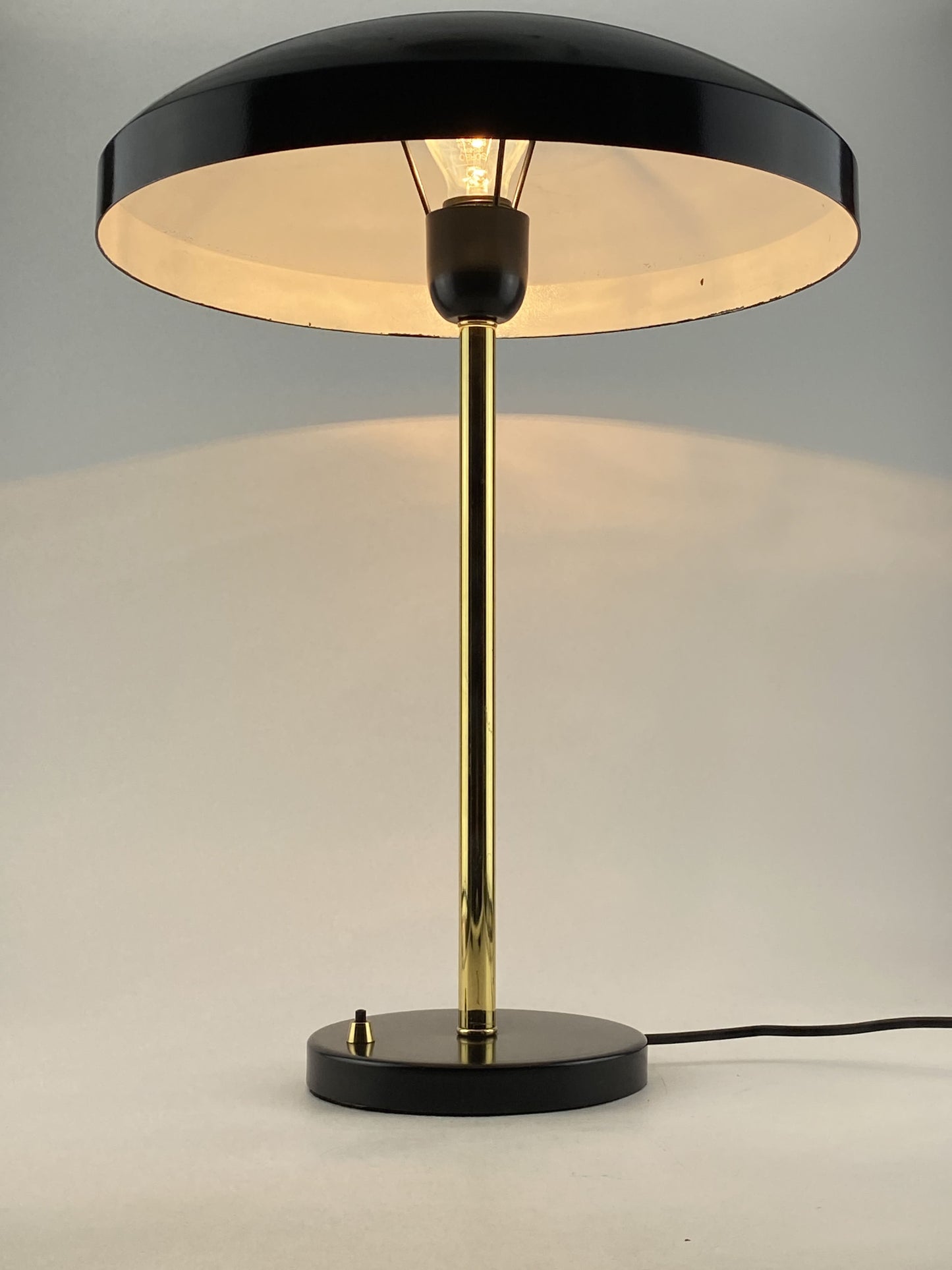 Rare black and gold table lamp UFO by Louis Kalff for Philips