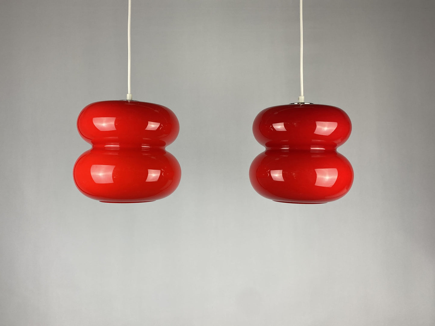 Set of two red pendant lights by Herwig and Frank Sterckx Glasfabriek De Rupel 1970