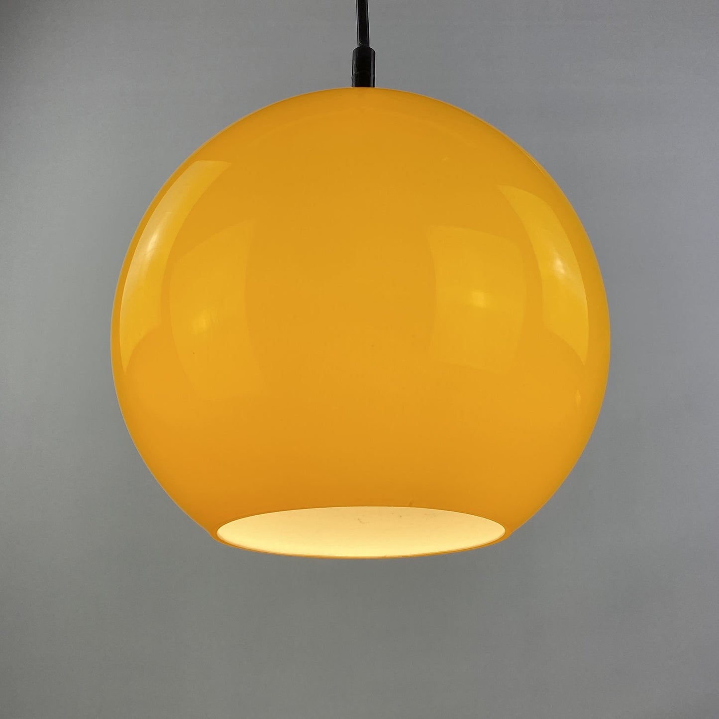 Yellow glass globe pendant light by Peill and Putzler 1960