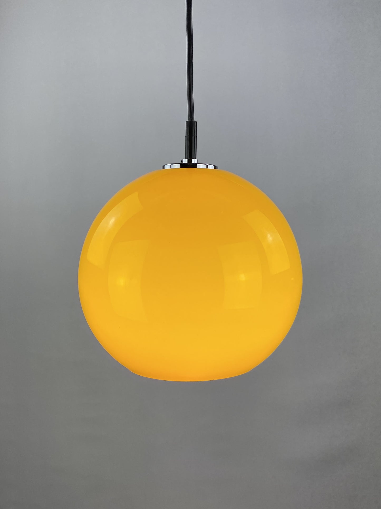 Yellow glass globe pendant light by Peill and Putzler 1960