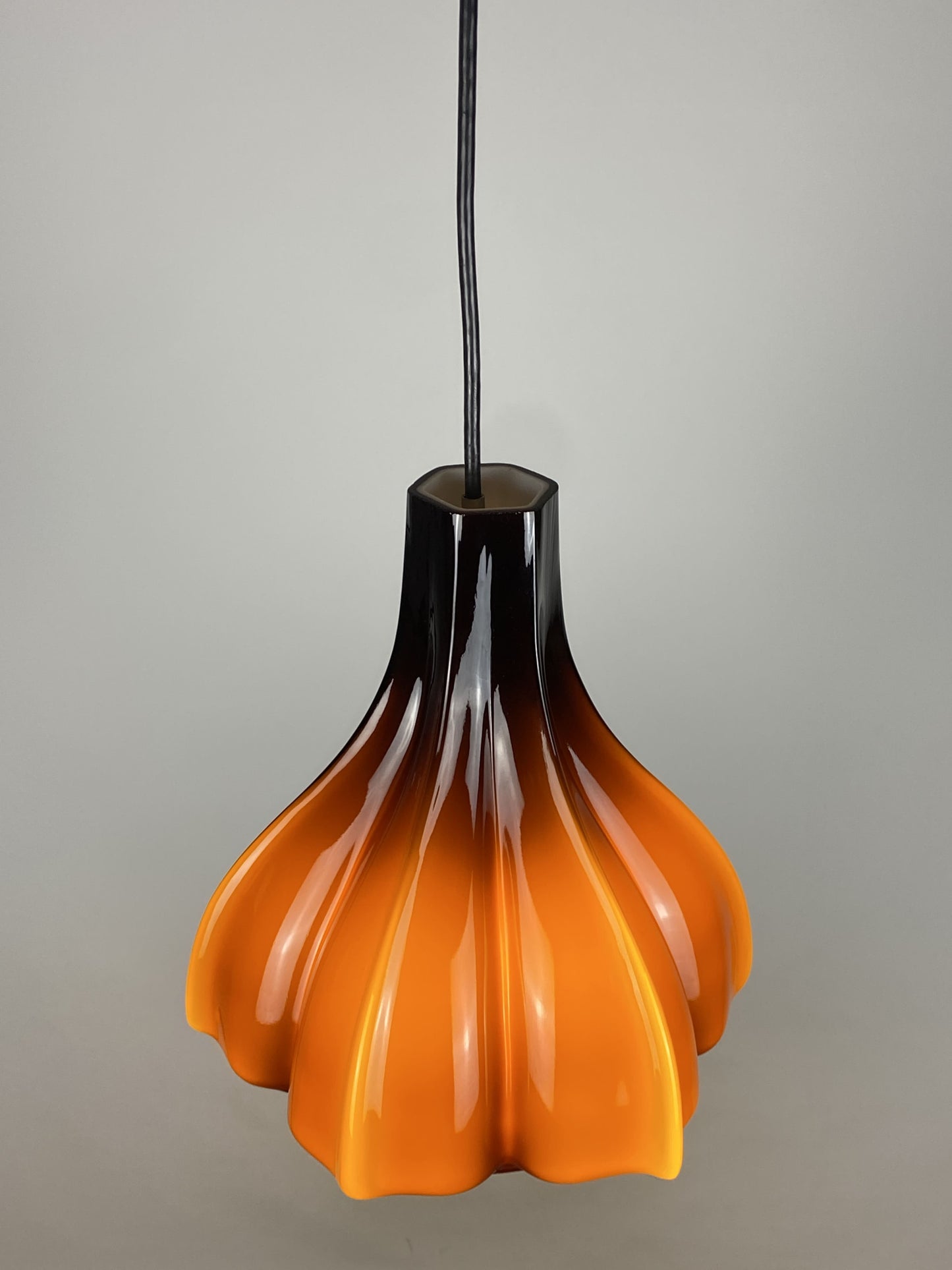 Flower shaped brown / caramel glass pendant light by Peill and Putzler 1960