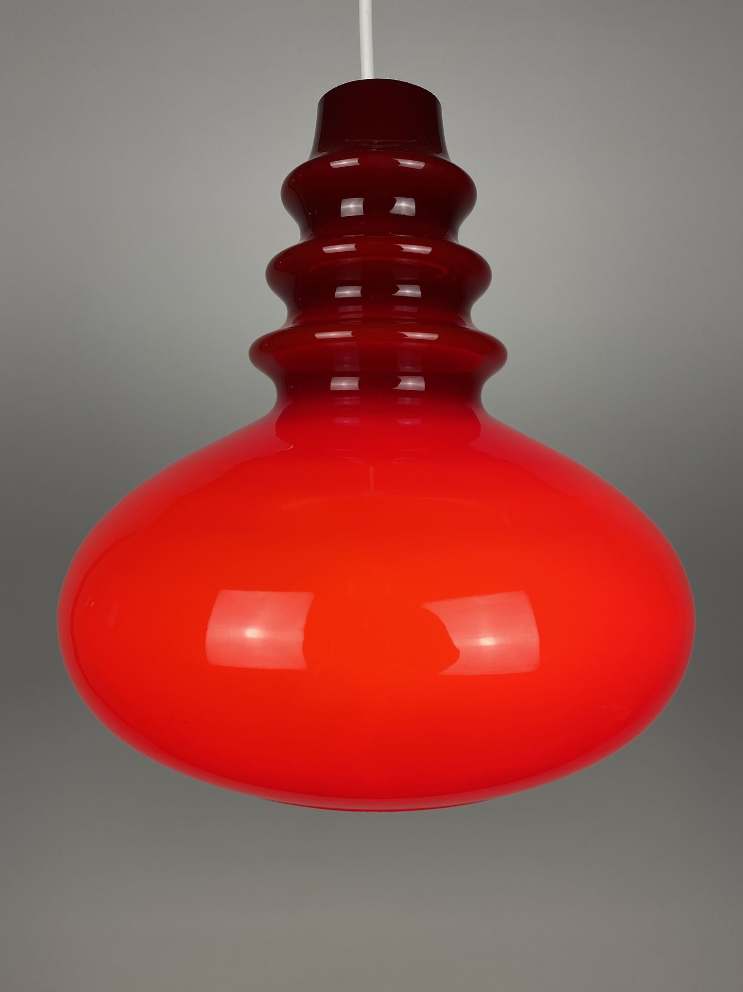 1 of 2 Dark red glass Peill & Putzler pendant light 1960