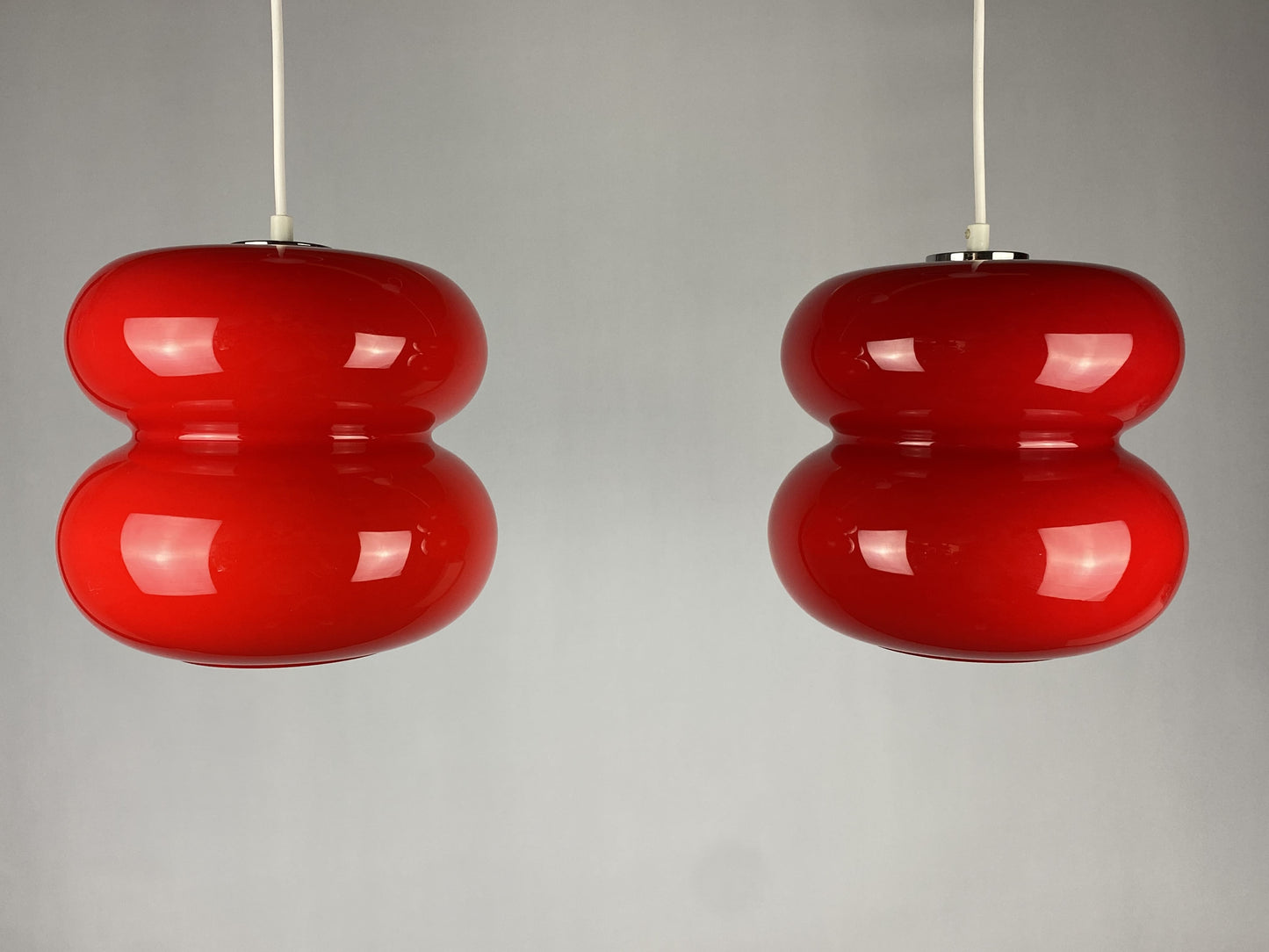 Set of two red pendant lights by Herwig and Frank Sterckx Glasfabriek De Rupel 1970
