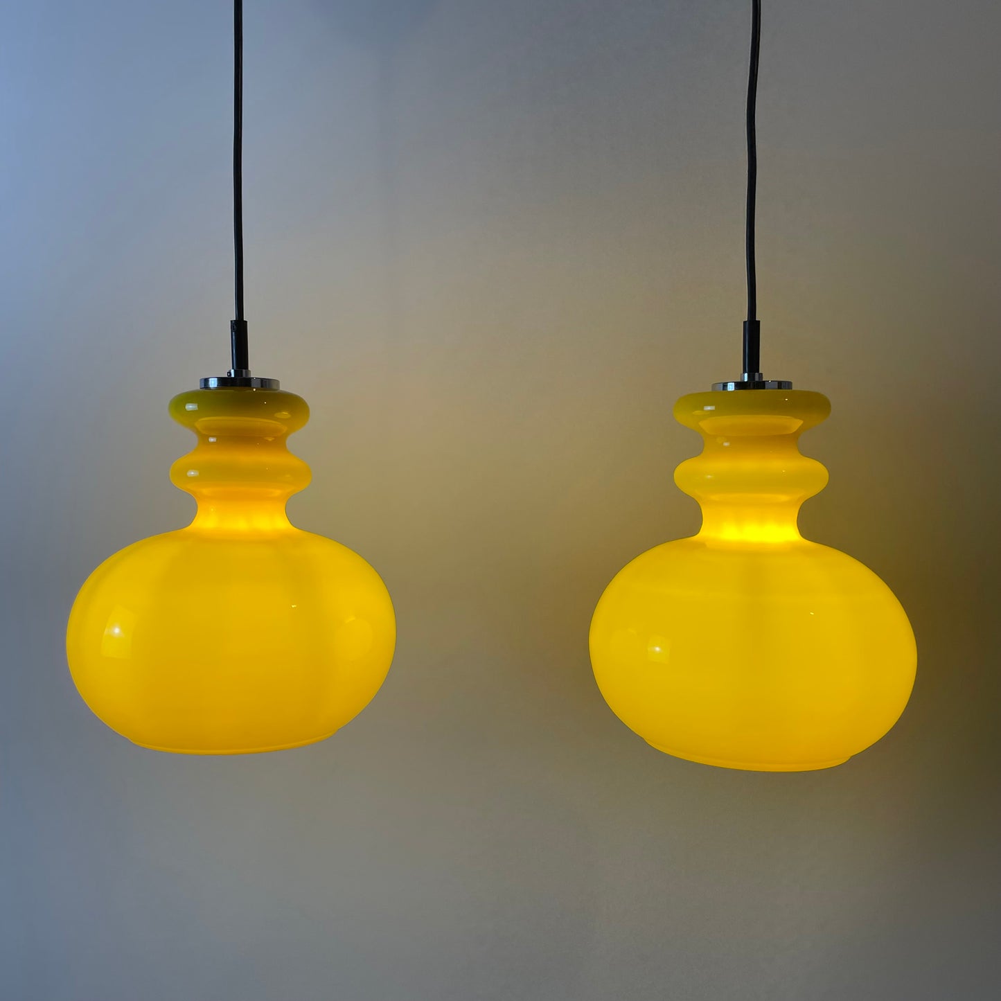 pair of yellow glass pendant lights
Peill & Putzler 1960s lighting
vintage mid-century modern pendants
retro yellow glass lamps for sale
German glass pendant lights
