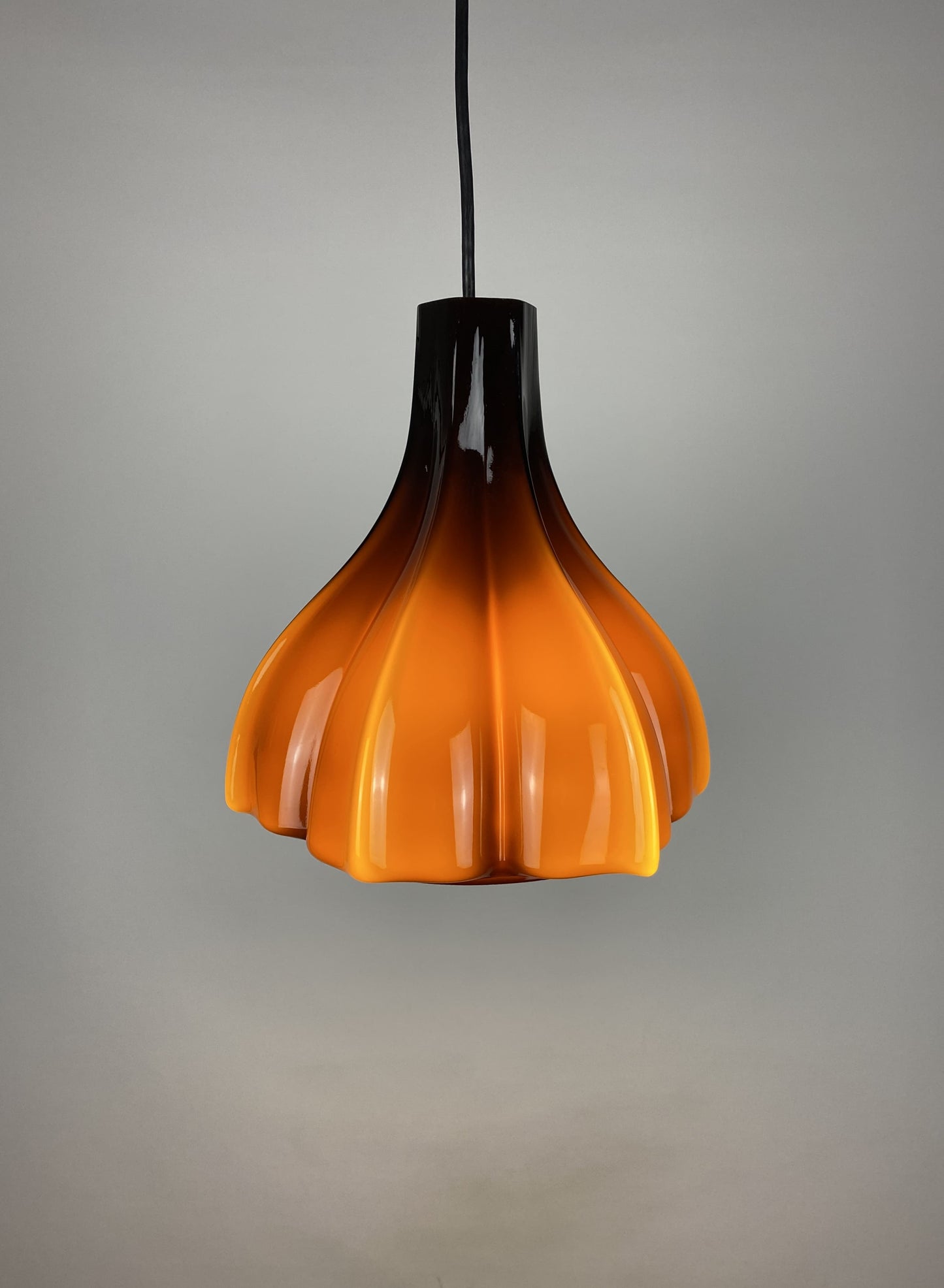 Flower shaped brown / caramel glass pendant light by Peill and Putzler 1960