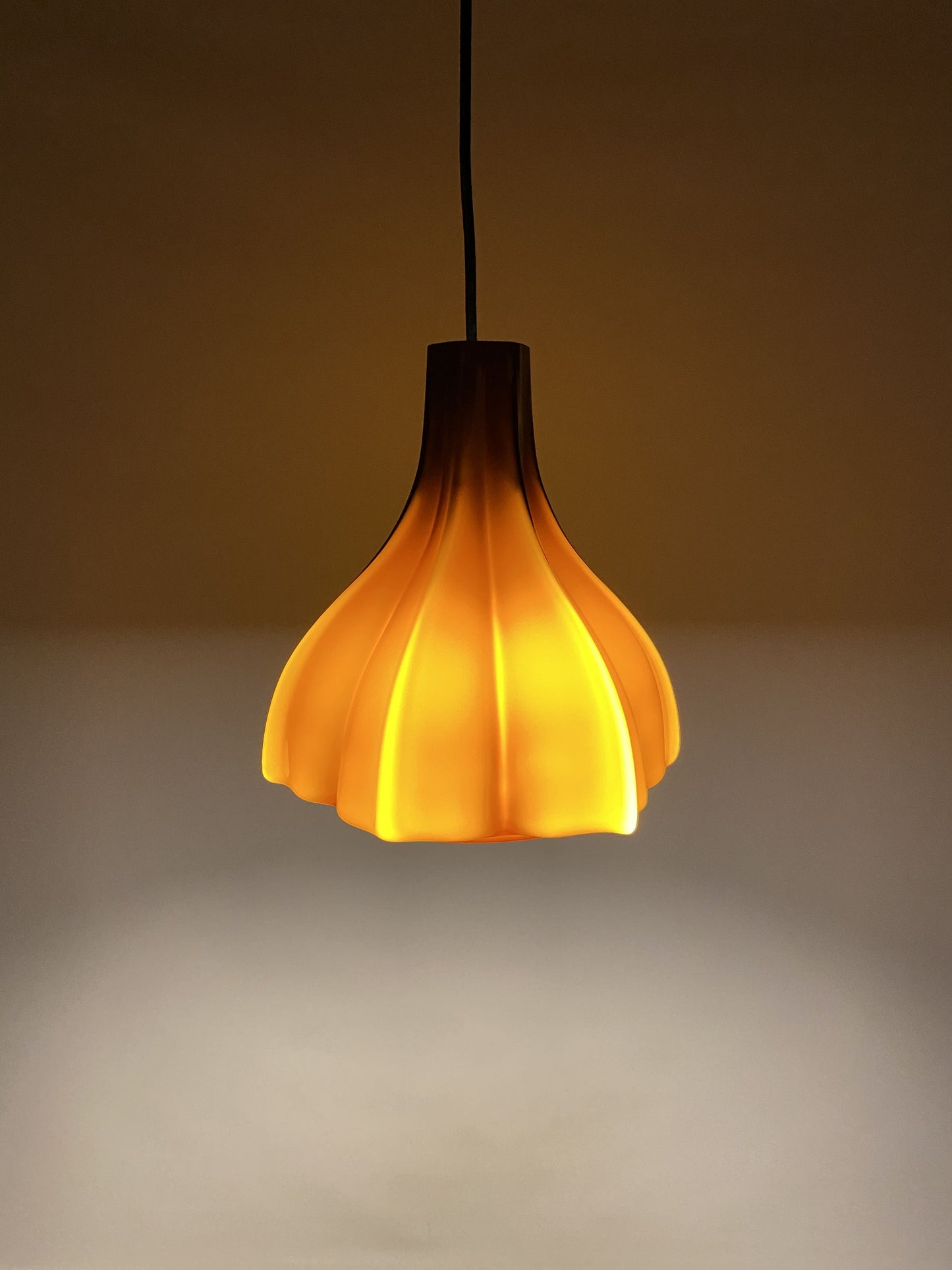 Flower shaped brown / caramel glass pendant light by Peill and Putzler 1960