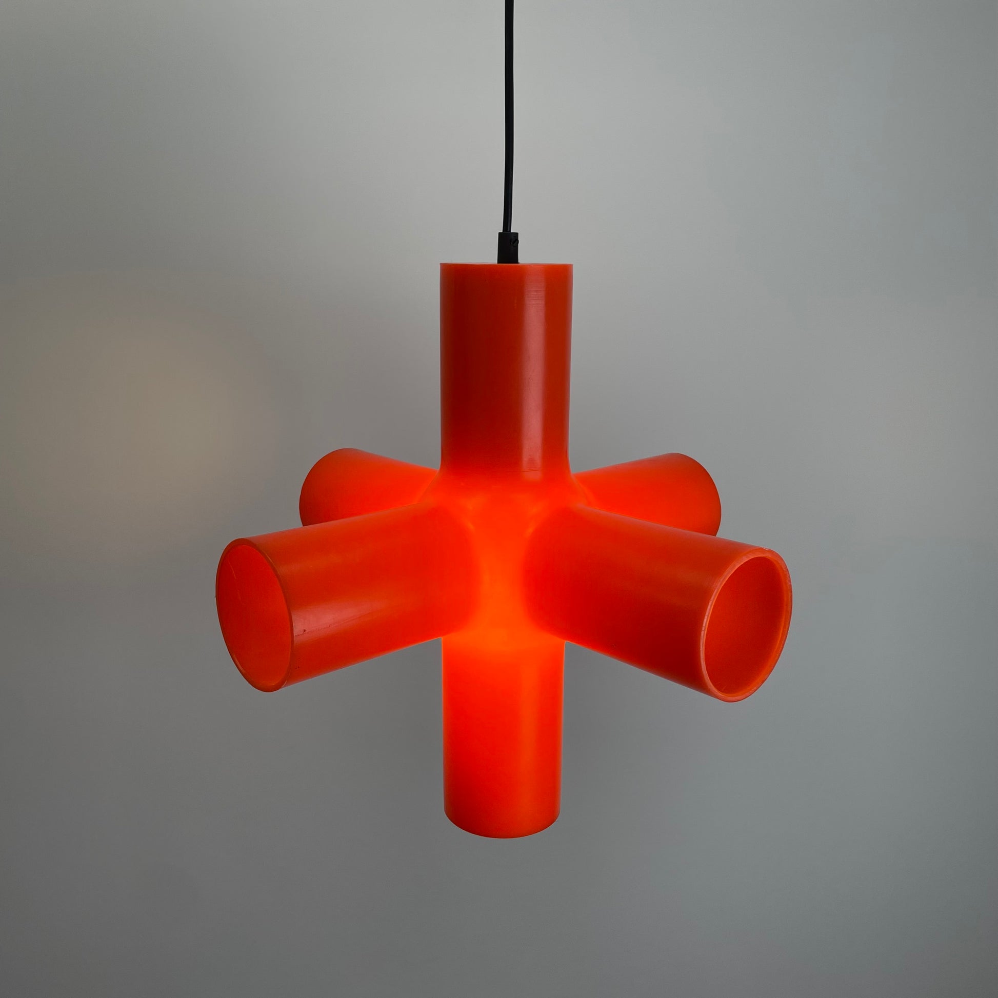 Crosslight pendant lamp
Jan Melis Ben Oostrum design
Dark lighting 2000s
orange plastic pendant lamp
award-winning modern lamp
geometric design pendant
vintage inspired modern lighting
collectible Crosslight lamp
bold statement ceiling light
Dutch designer pendant lamp