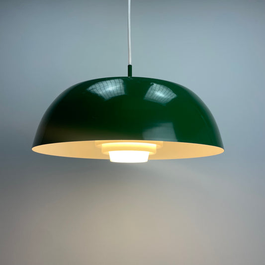 Danish UFO pendant lamp
green mid-century ceiling light
1960s Danish lighting design
metal and plexiglass pendant
Space Age hanging lamp
vintage green pendant lamp
Scandinavian modern lighting
trapezoid diffuser pendant
unknown designer Danish lamp
retro UFO shaped light fixture