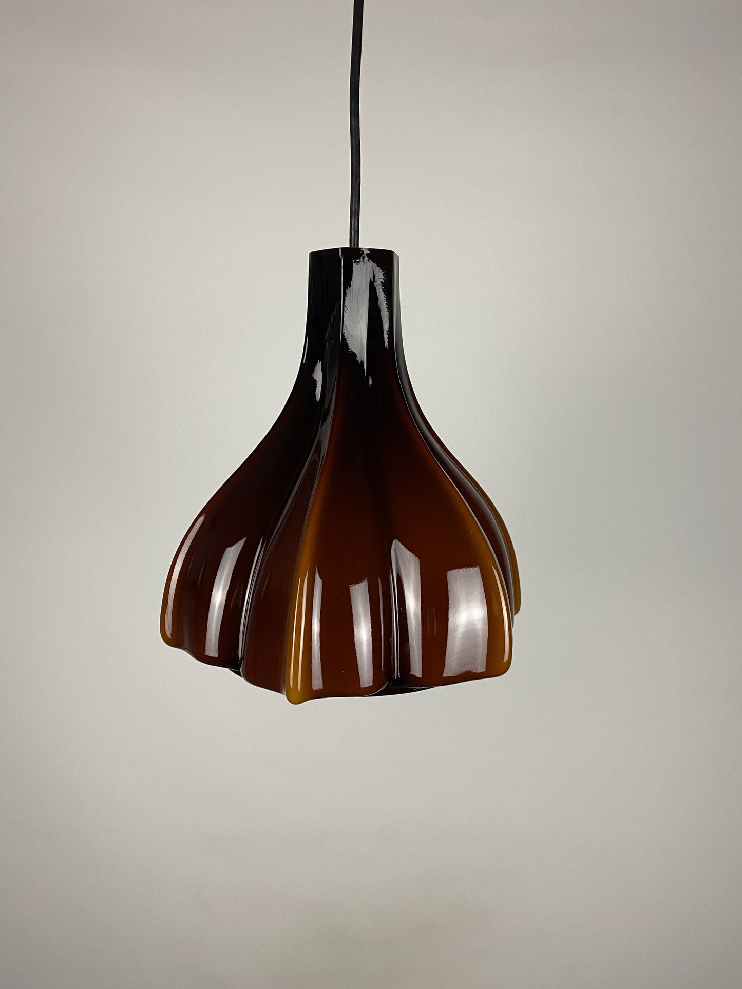 Flower shaped brown / caramel glass pendant light by Peill and Putzler 1960