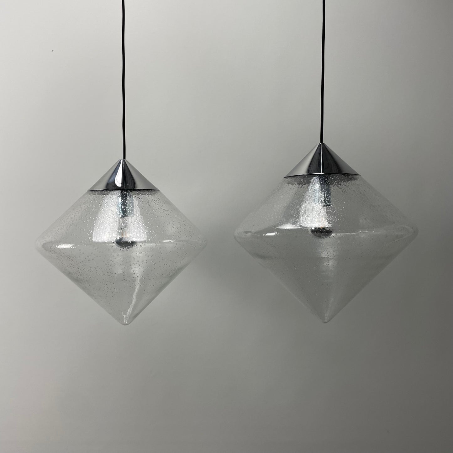 Pair of glass diamond shaped pendant lights B1216.0000 by RAAK , 1970