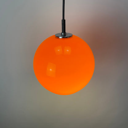 Orange glass globe pendant light by Peill and Putzler 1960