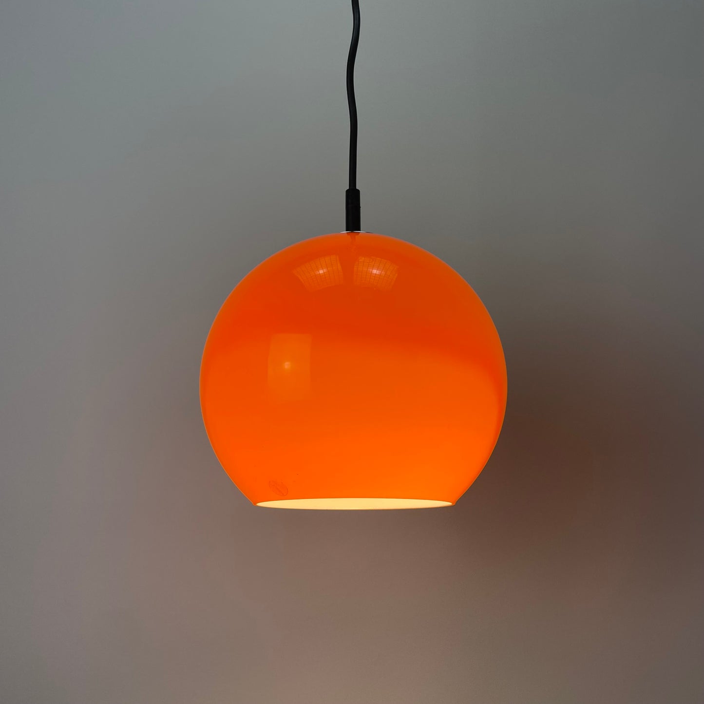 Orange glass globe pendant light by Peill and Putzler 1960