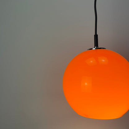 Orange glass globe pendant light by Peill and Putzler 1960