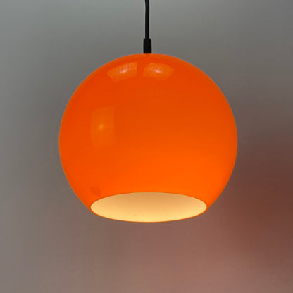 Orange glass globe pendant light
Peill and Putzler lighting
1960s vintage lamp
Opaline glass pendant
Mid-century modern lighting
Vintage pendant light
Original hanging fixture
Unique home decor
Soft ambient light
Statement lighting piece