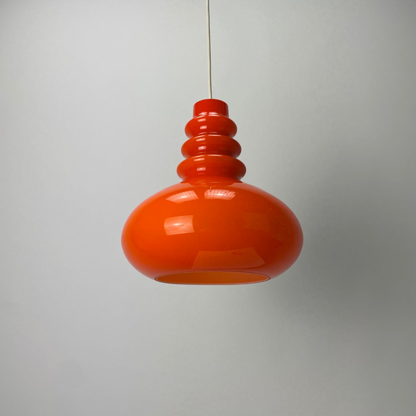 Orange midcentury glass pendant light by Peill & Putzler 1960