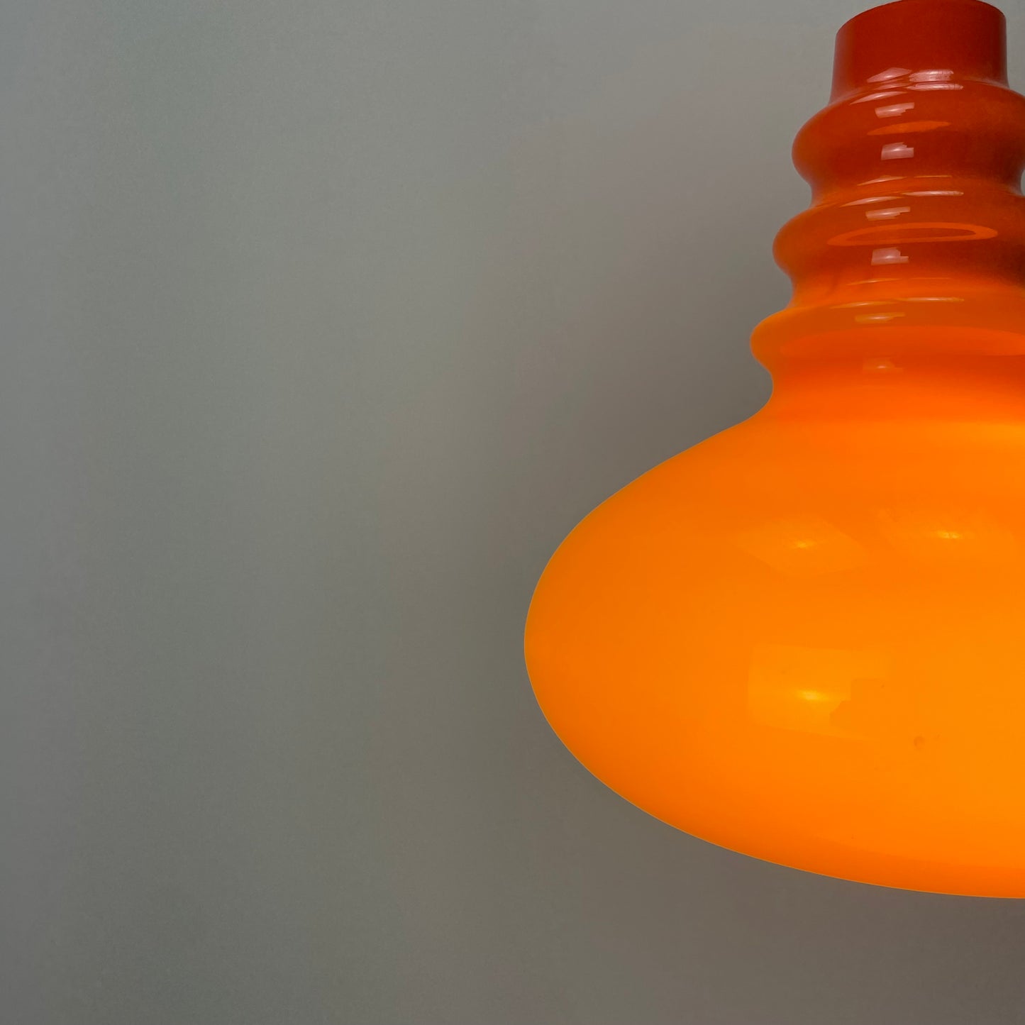 Orange midcentury glass pendant light by Peill & Putzler 1960