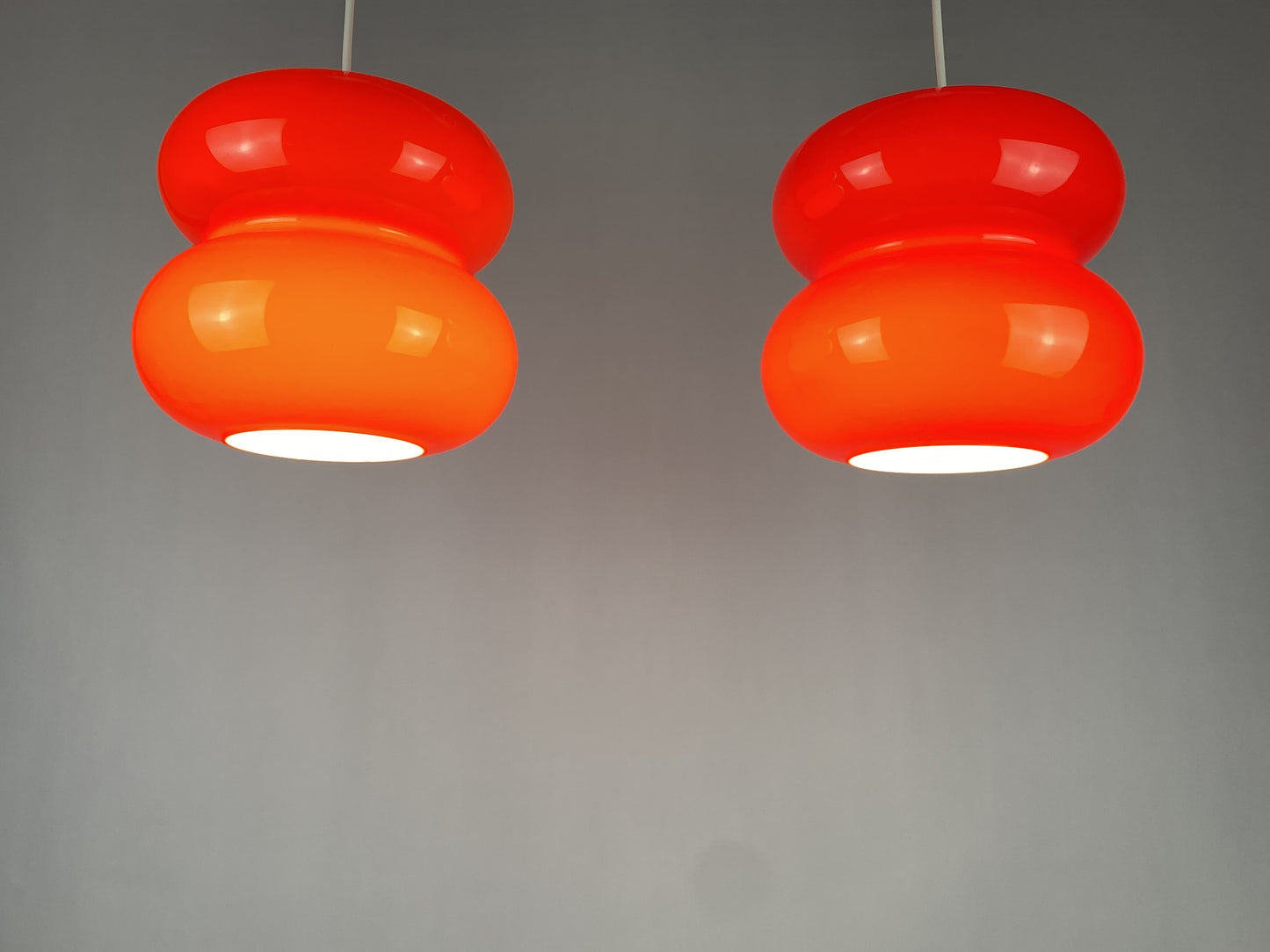 Set of two red pendant lights by Herwig and Frank Sterckx Glasfabriek De Rupel 1970