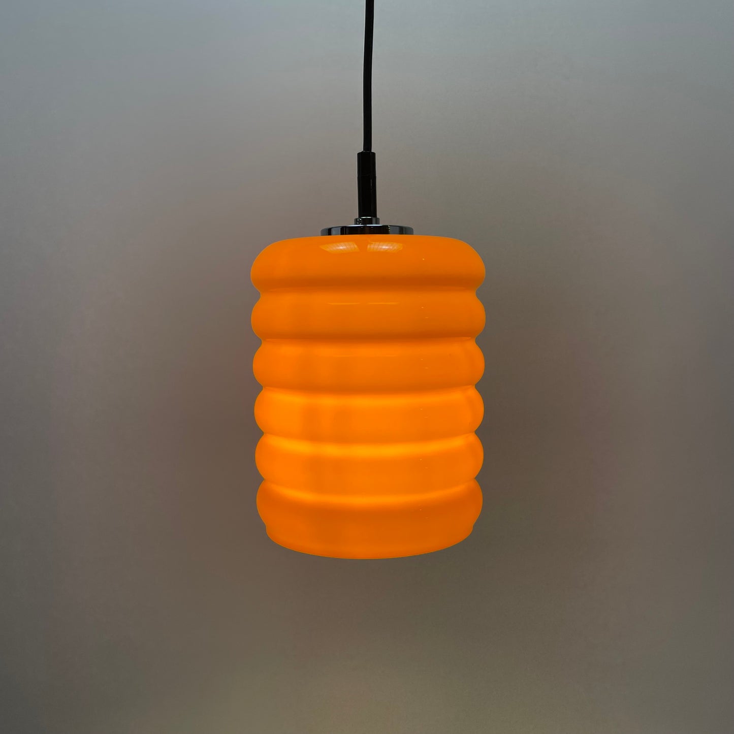 Ribbed orange glass pendant light from 1960