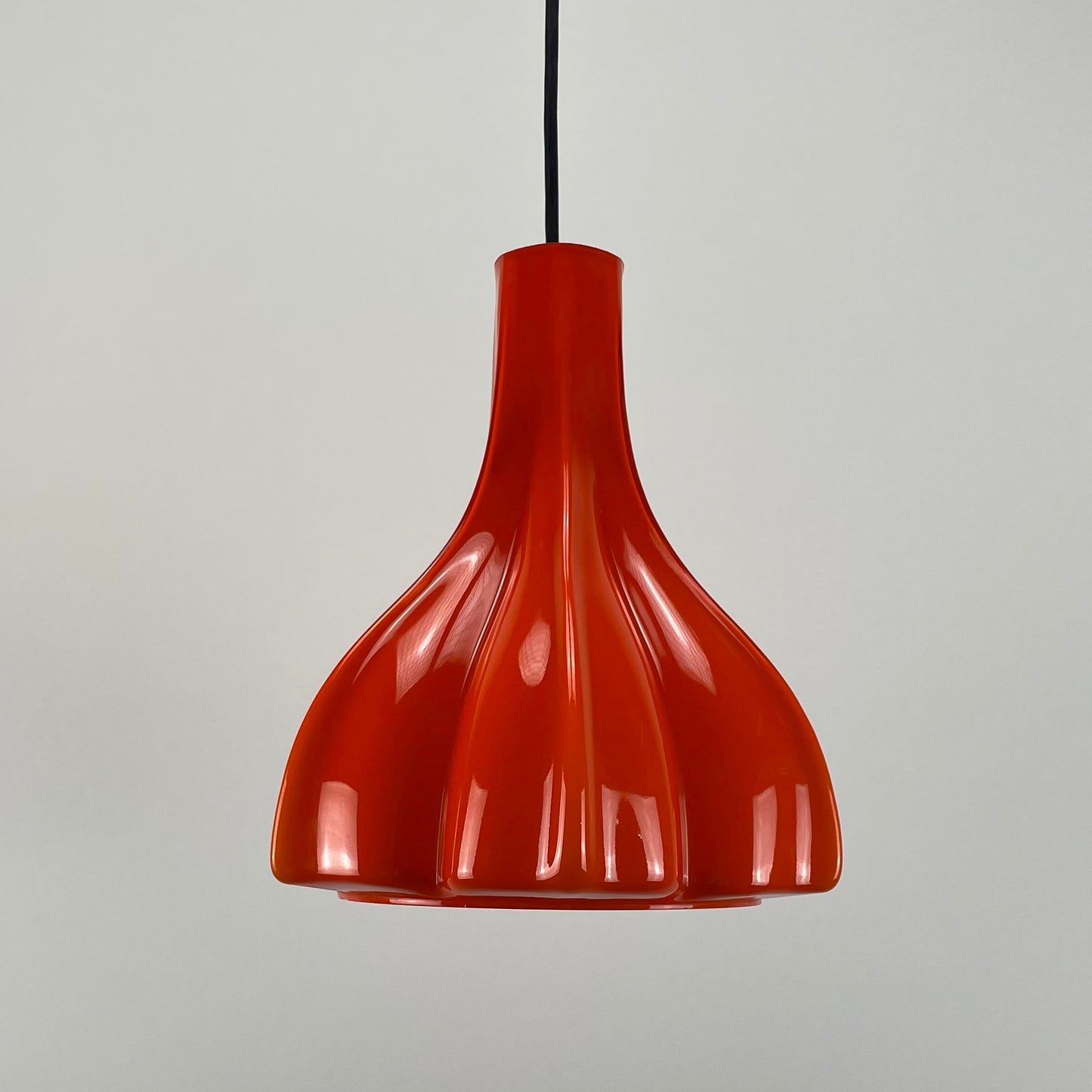 Flower shaped orange glass pendant light by Peill and Putzler 1960