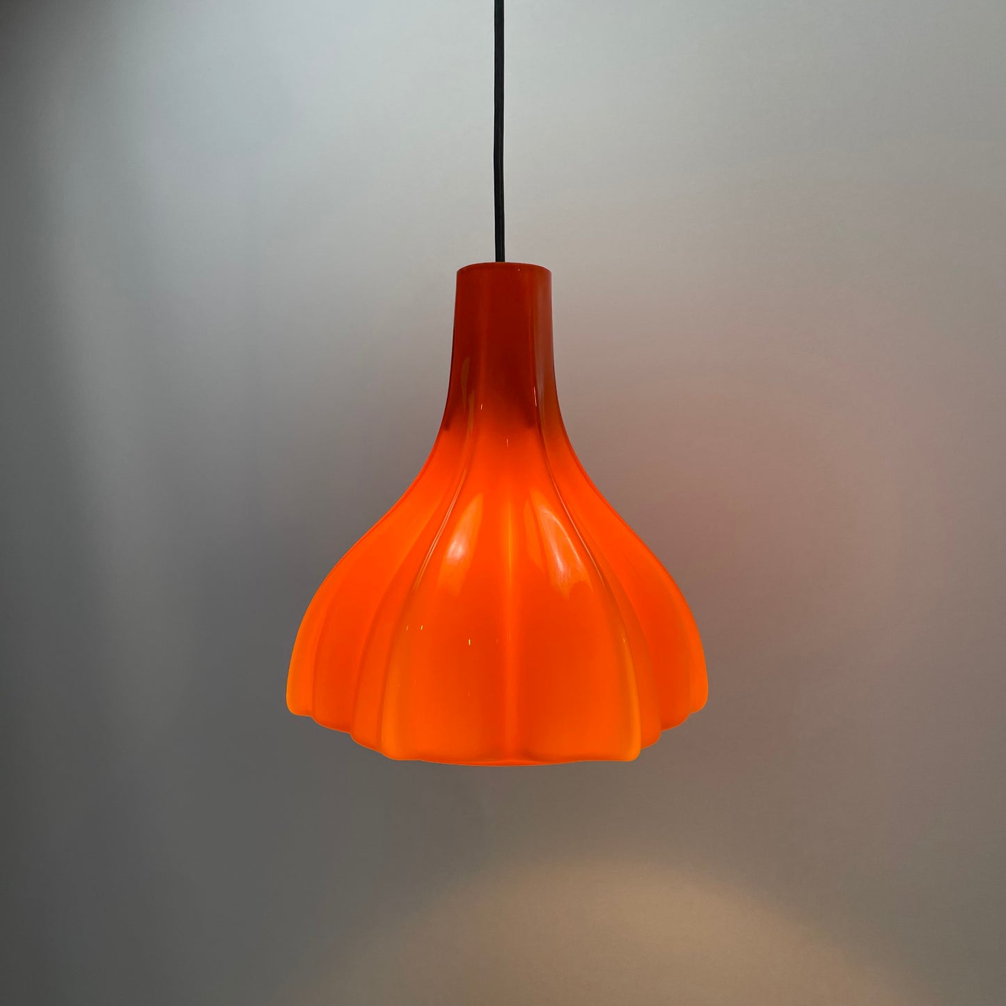 Flower shaped orange glass pendant light by Peill and Putzler 1960