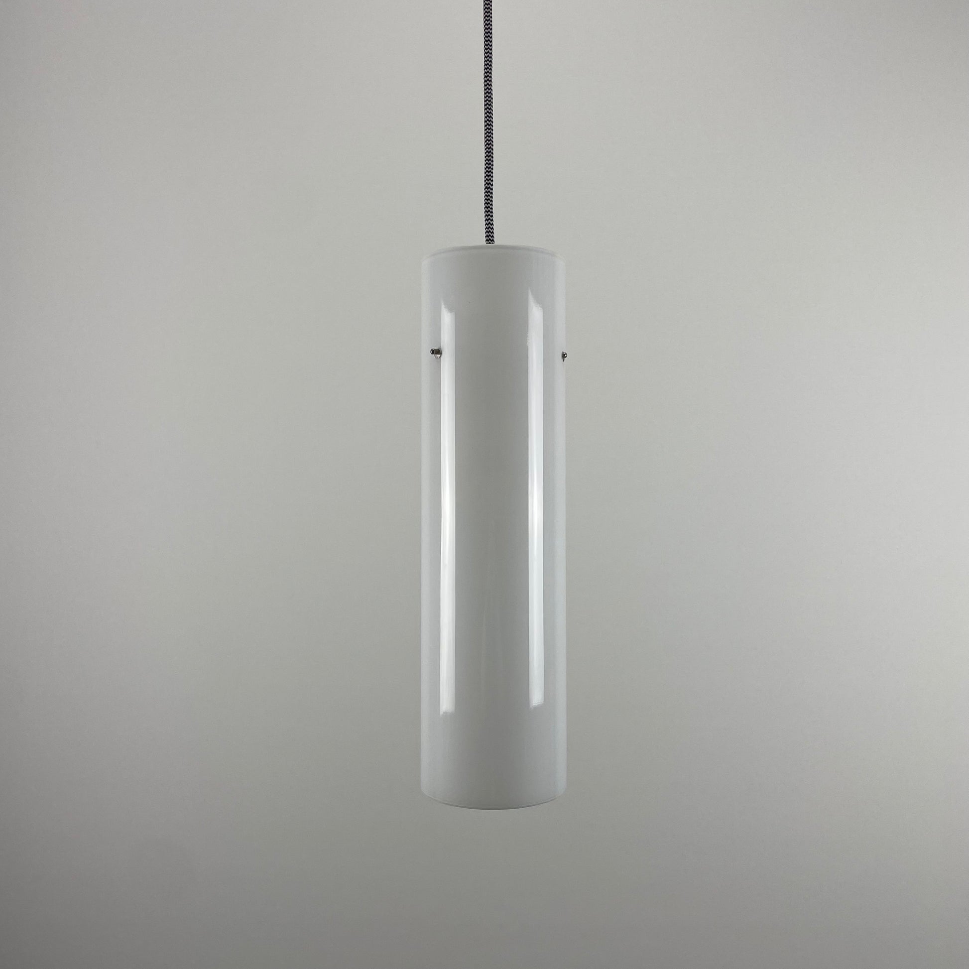 white glass cylinder-shaped pendant light
Glashütte Limburg 1970s lighting
mid-century modern pendant lamp
vintage white glass pendant light for sale
minimalist glass lighting design