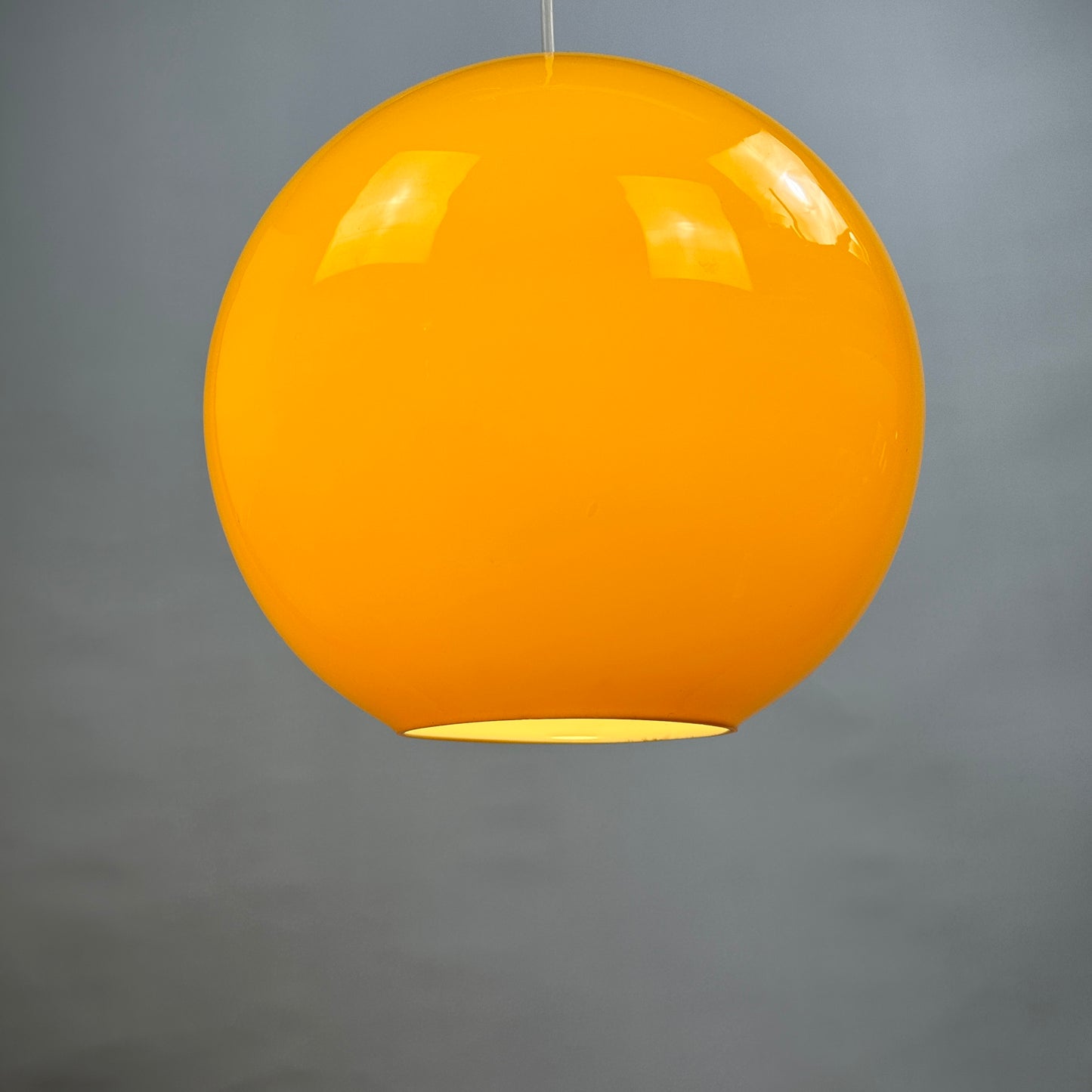 Yellow glass globe pendant light XL by Peill and Putzler 1960