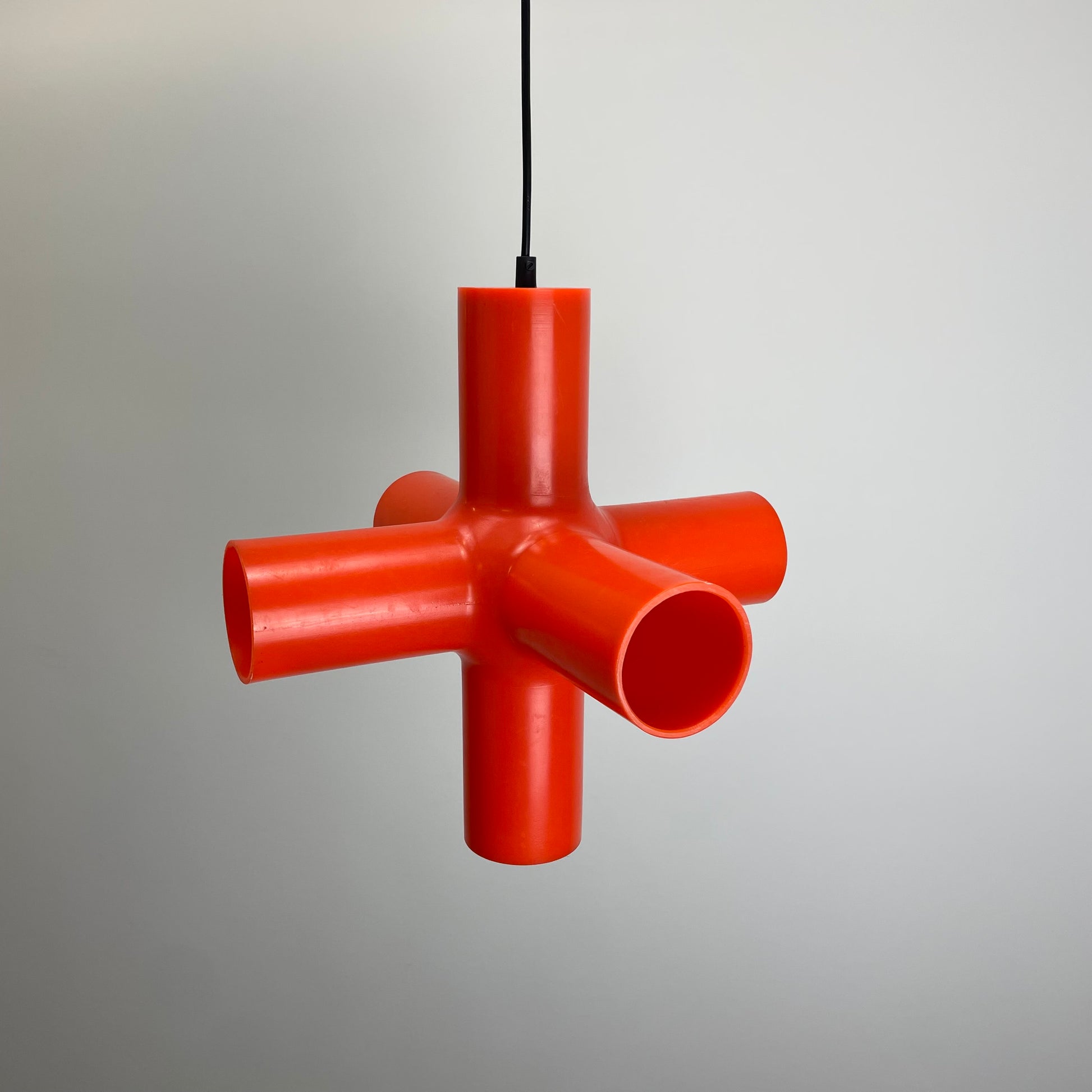 Crosslight pendant lamp
Jan Melis Ben Oostrum design
Dark lighting 2000s
orange plastic pendant lamp
award-winning modern lamp
geometric design pendant
vintage inspired modern lighting
collectible Crosslight lamp
bold statement ceiling light
Dutch designer pendant lamp