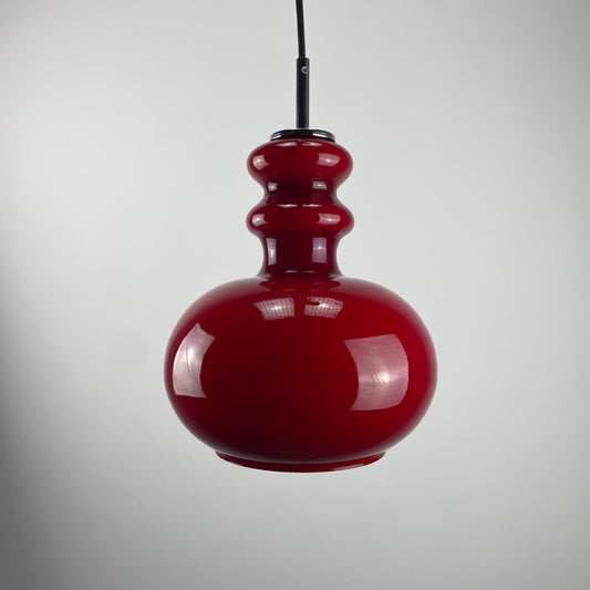 Red glass pendant light by Peill and Putzler, 1960