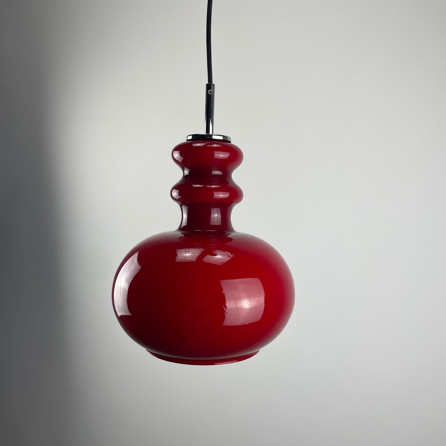 Red glass pendant light by Peill and Putzler, 1960