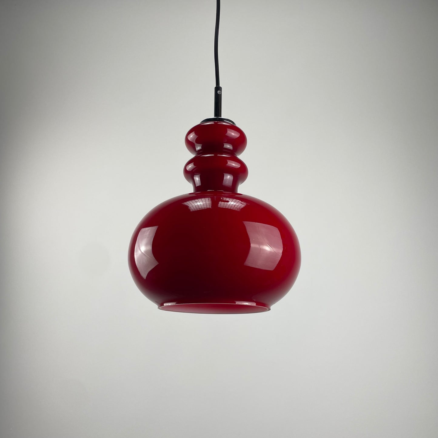 Red glass pendant light by Peill and Putzler, 1960