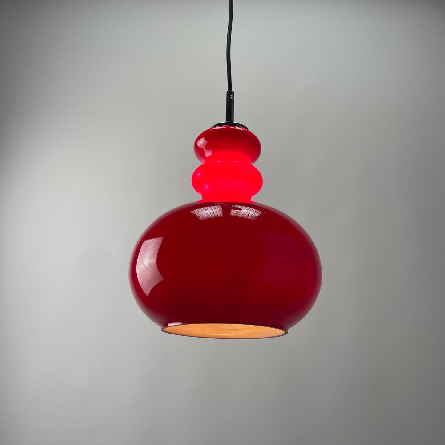 Red glass pendant light by Peill and Putzler, 1960