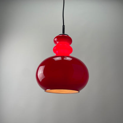 Red glass pendant light by Peill and Putzler, 1960