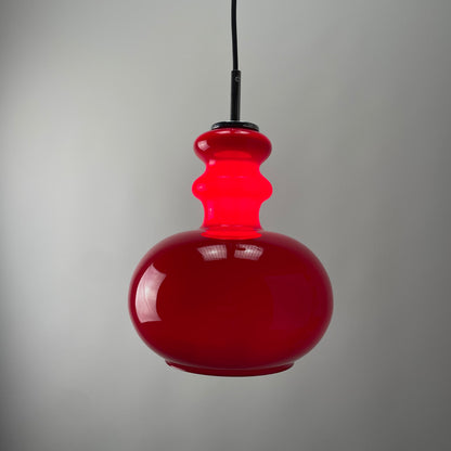 Red glass pendant light by Peill and Putzler, 1960